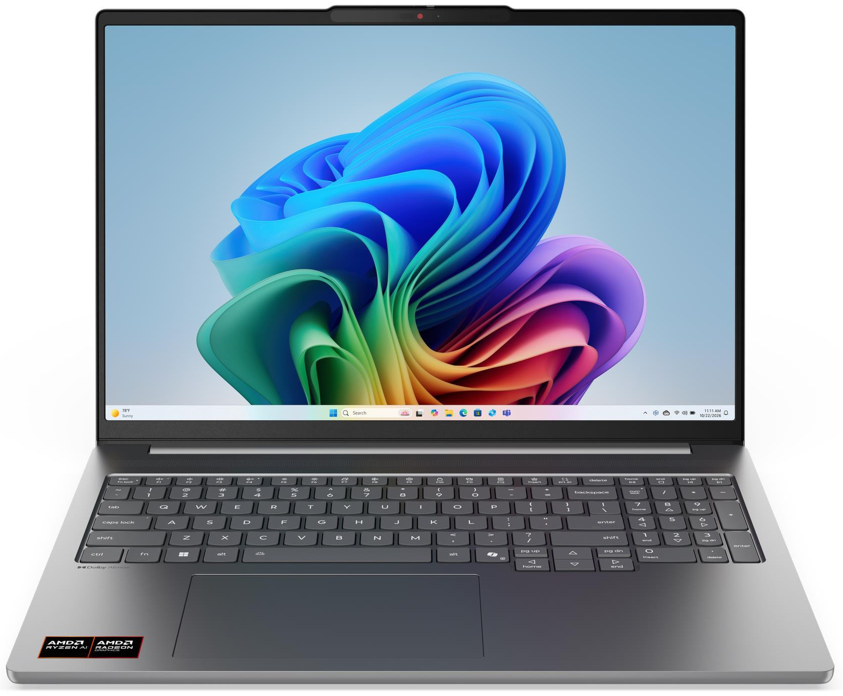 Ezüst laptop színes háttérképpel a képernyőn.