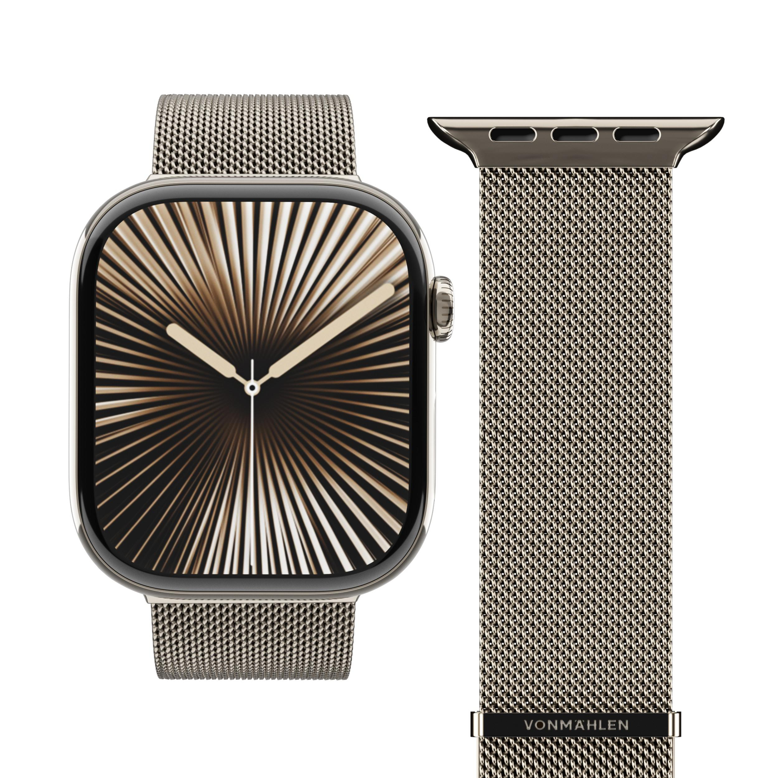 Eine silberne Smartwatch mit einem bronzefarbenen Zifferblatt und einem Milanese-Armband daneben.