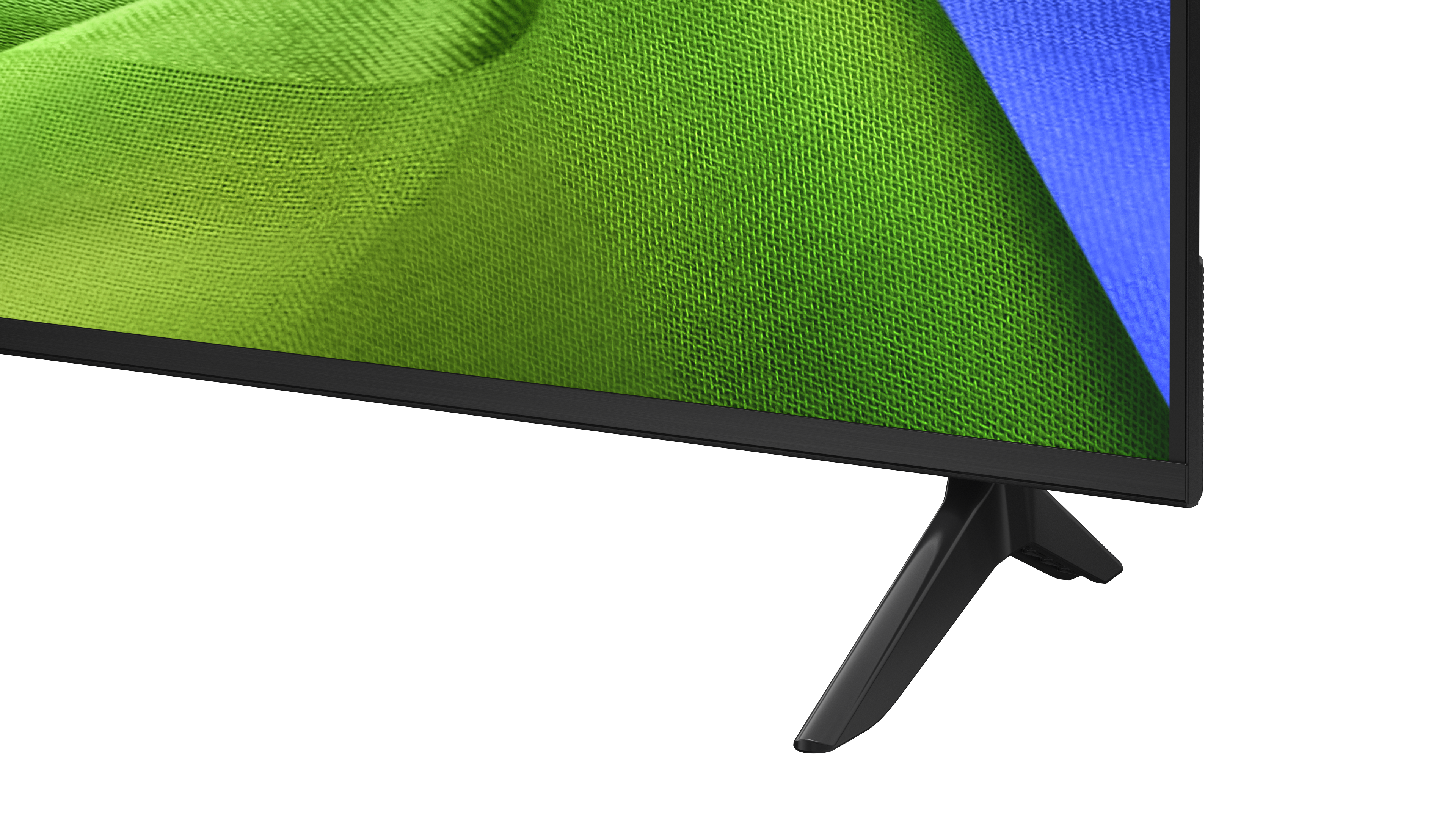 Ein moderner Fernseher mit einem schwarzen Ständer und einem Bildschirm, der grüne und blaue Texturen zeigt.