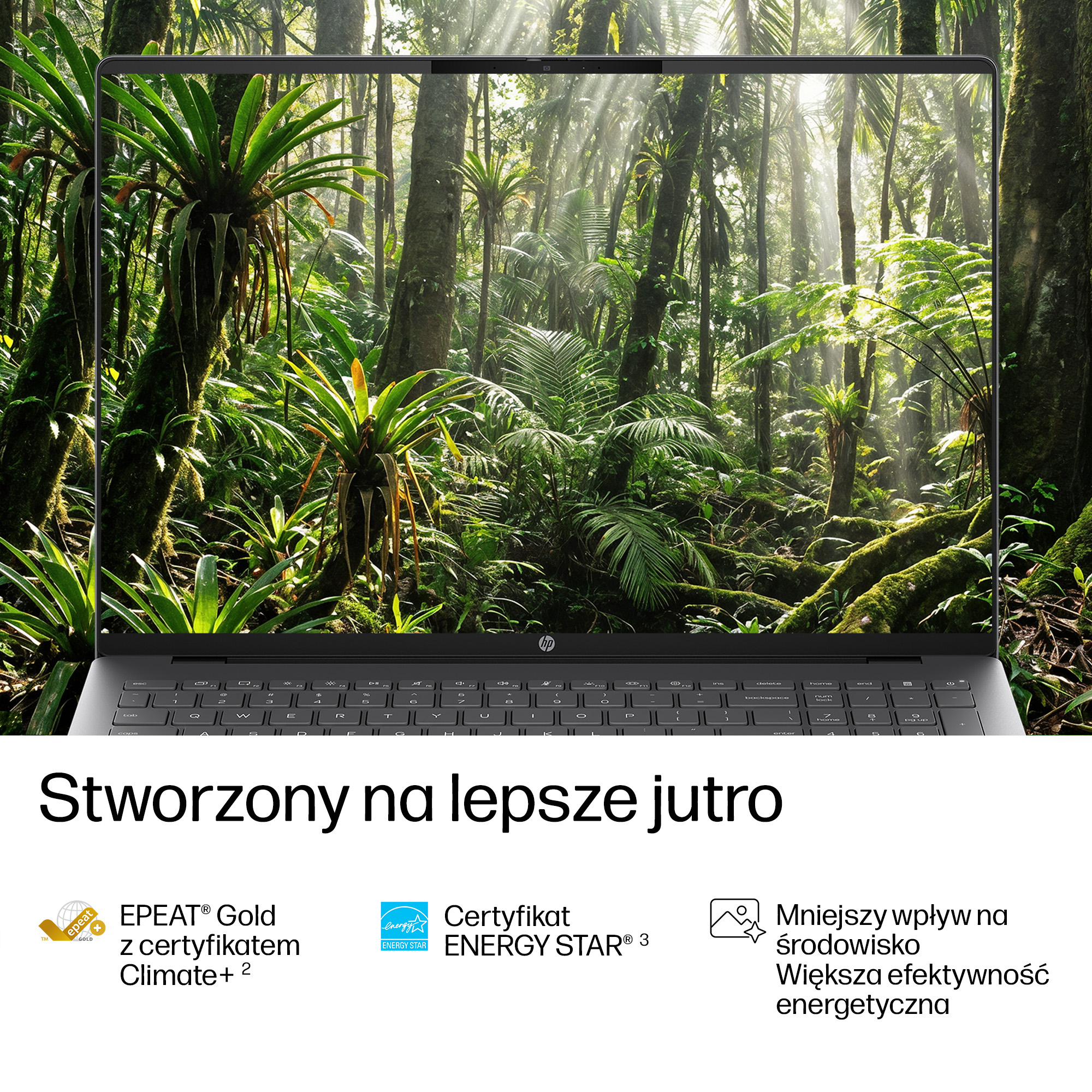 Laptop z ekranem i klawiaturą z dżunglą. Tekst i loga poniżej.