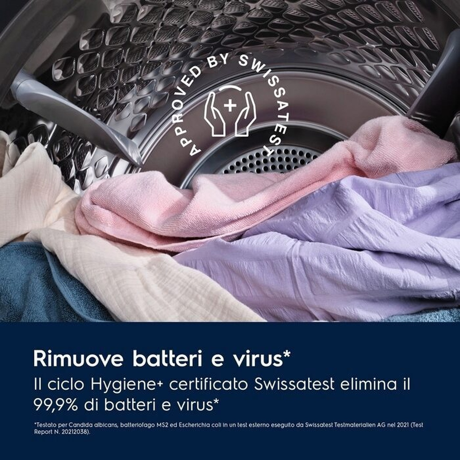 Interno di un'asciugatrice con bucato colorato e sigillo 'Approved by Swissatest'.