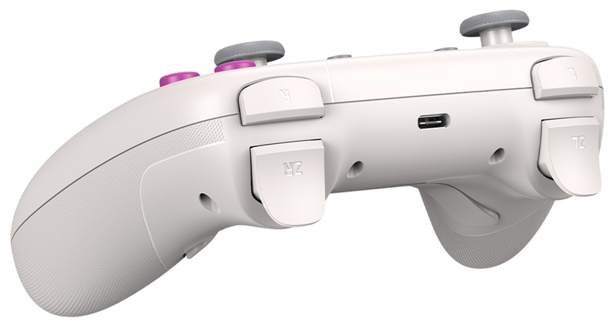 Biay kontroler z szarymi joystickami i rowymi przyciskami.