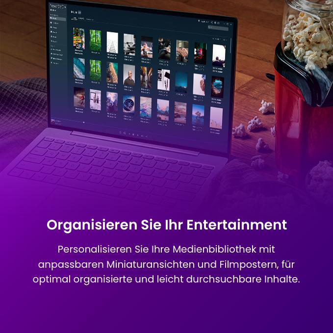 Ein Laptop zeigt eine Medienbibliothek mit Filmcovern neben einer roten Popcornmaschine.