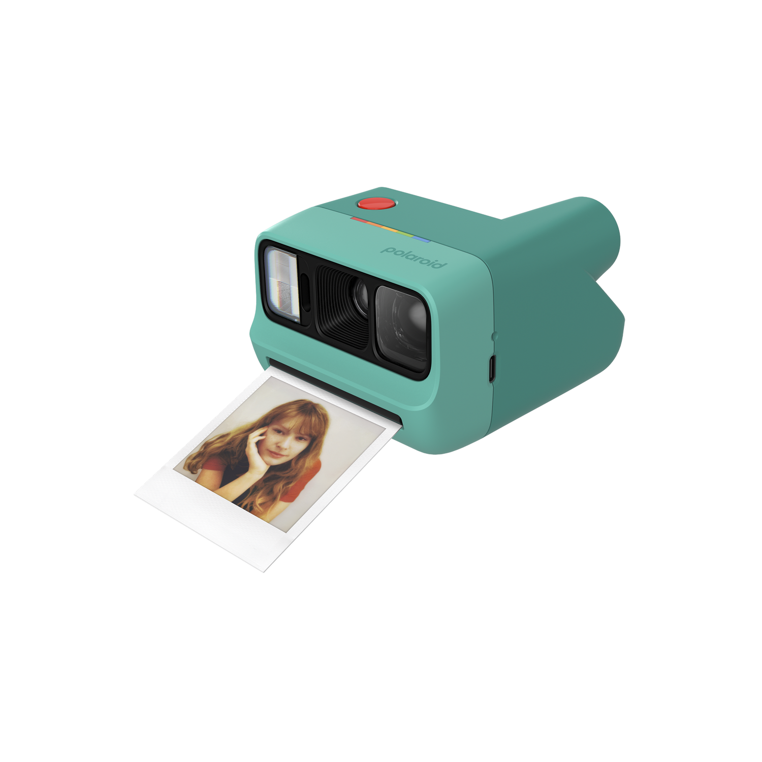 Una cámara Polaroid turquesa imprime una foto de una mujer joven con pelo largo.