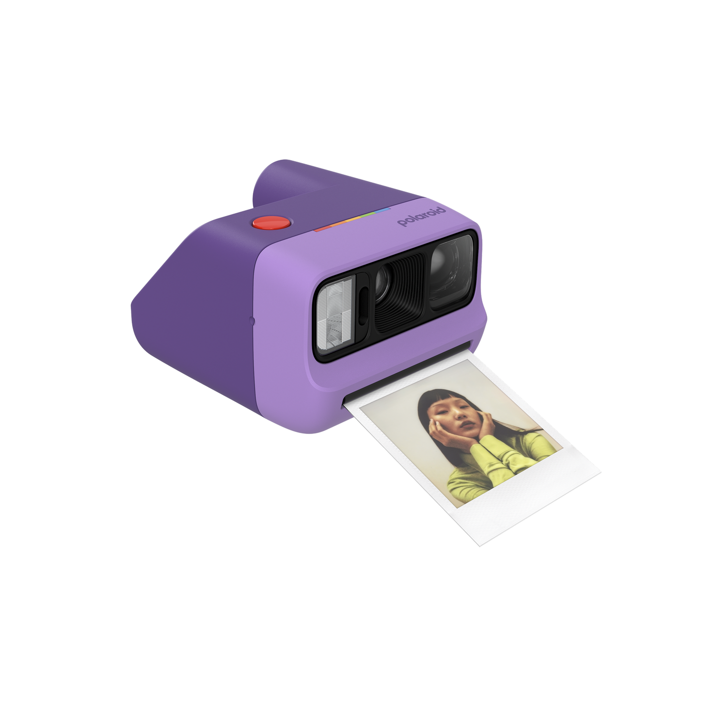 Cámara Polaroid morada con botón rojo y foto de mujer con top amarillo.