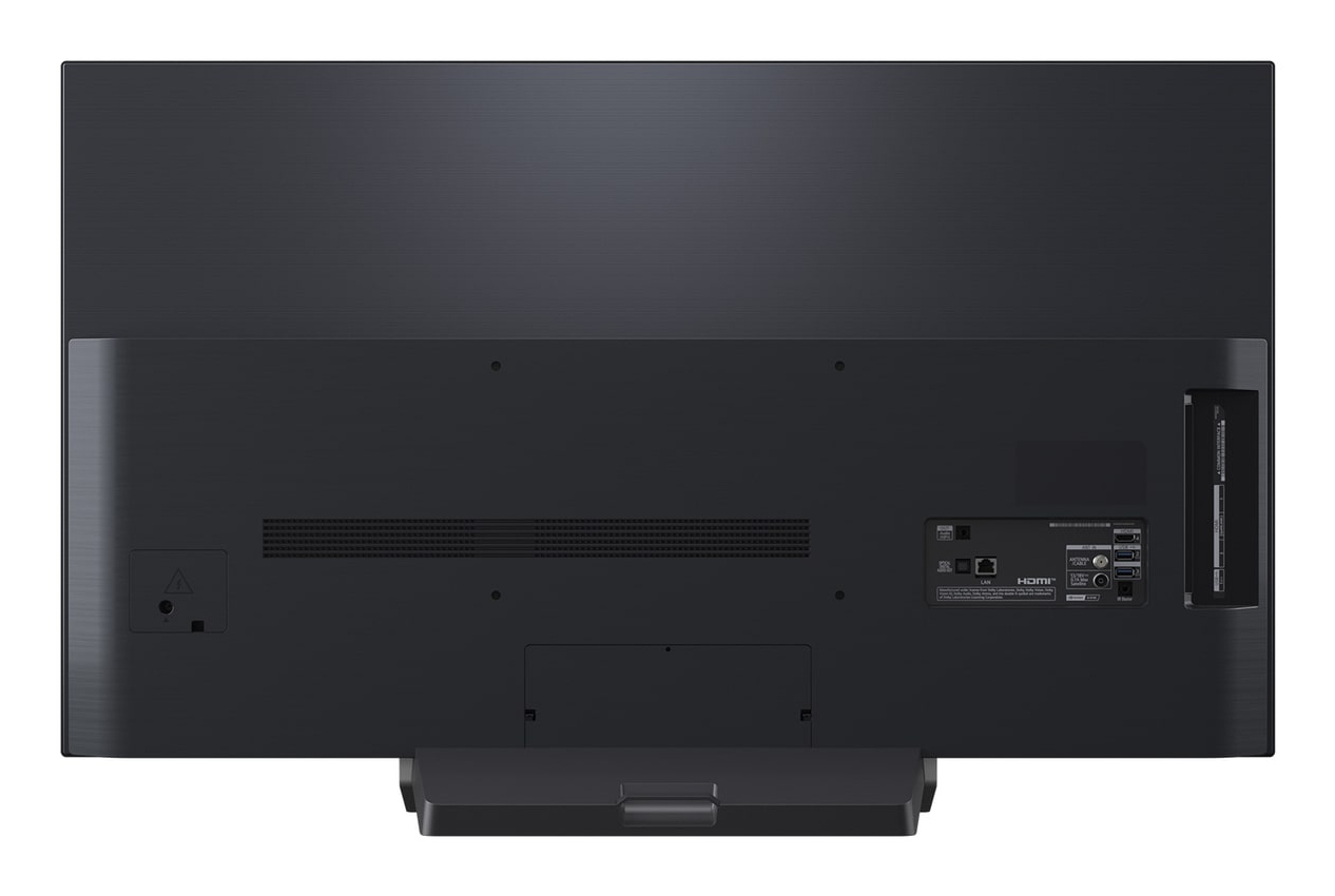 La parte trasera de un televisor negro que muestra puertos como HDMI y LAN.