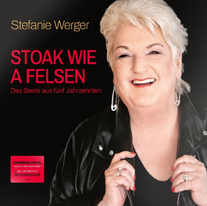 Stefanie Werger lacht, trägt Lederjacke und Schmuck. Albumtitel 'Stoak wie a Felsen'.