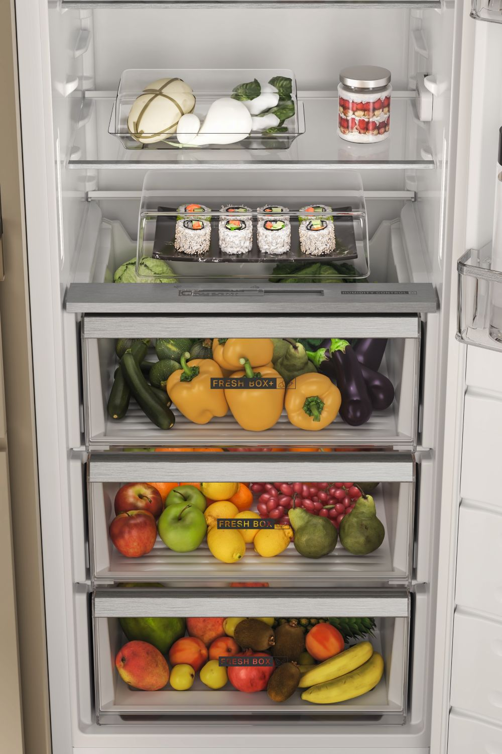 Refrigerador surtido con frutas y verduras frescas en varios cajones.