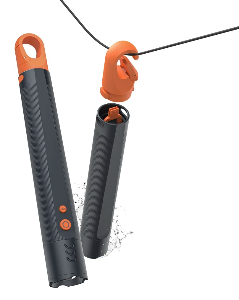 Dwa szare cylindry z pomarańczowymi akcentami na czarnej linie.