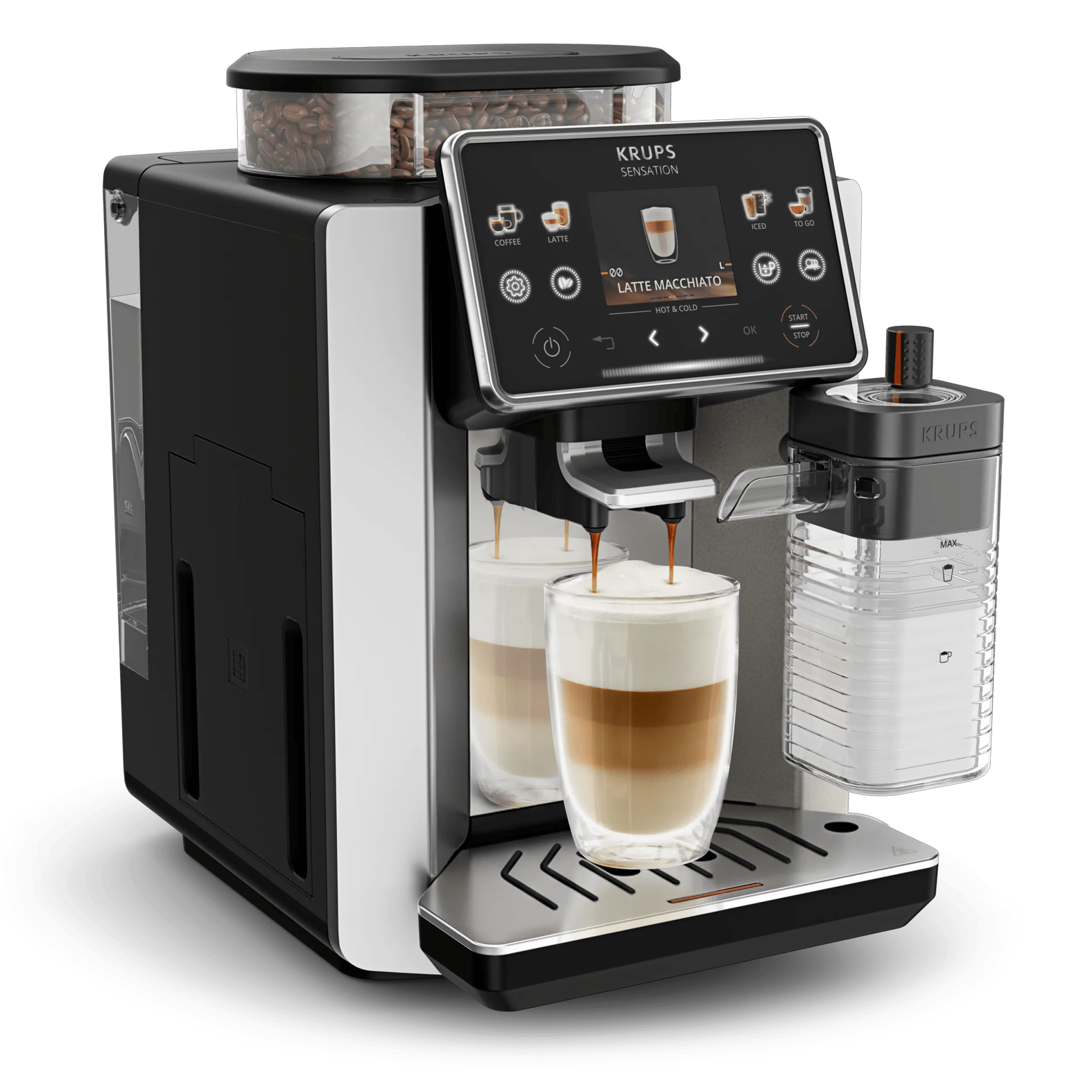 Eine Krups Kaffeemaschine brüht einen Latte Macchiato in ein Glas mit Schichten.