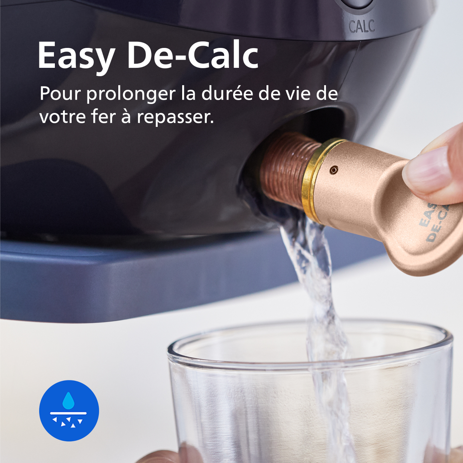 Water pours from a de-calc cartridge into a glass.