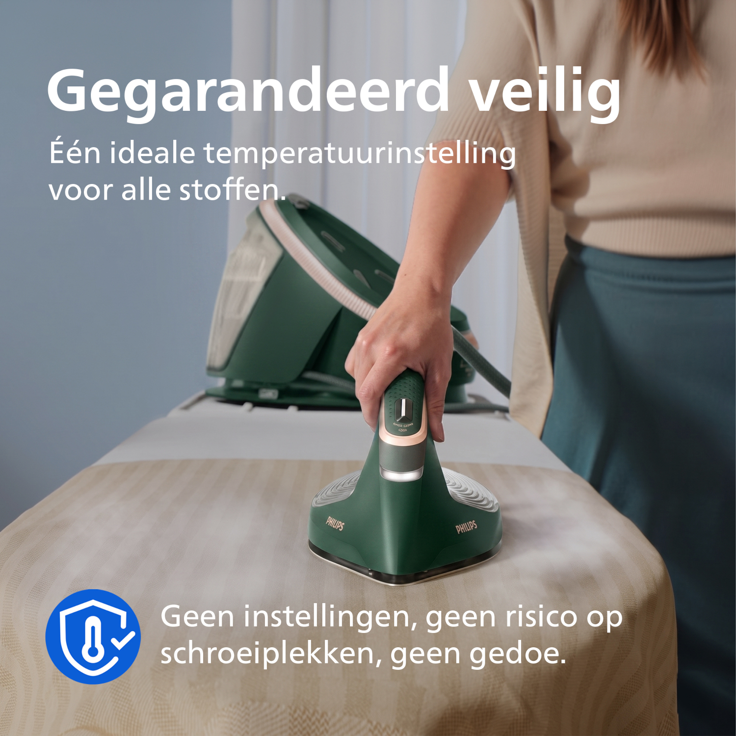 Steam iron on ironing board, steam released. Safe temperature.