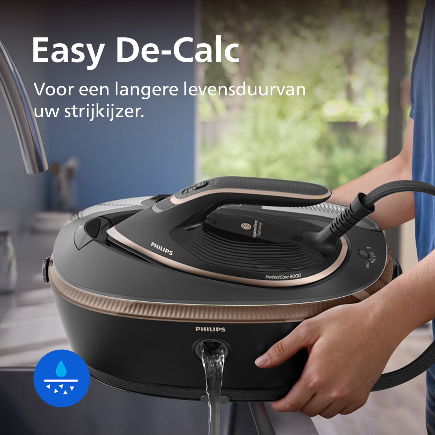 A person decalcifies a black Philips PerfectCare 8000 iron station under running water.