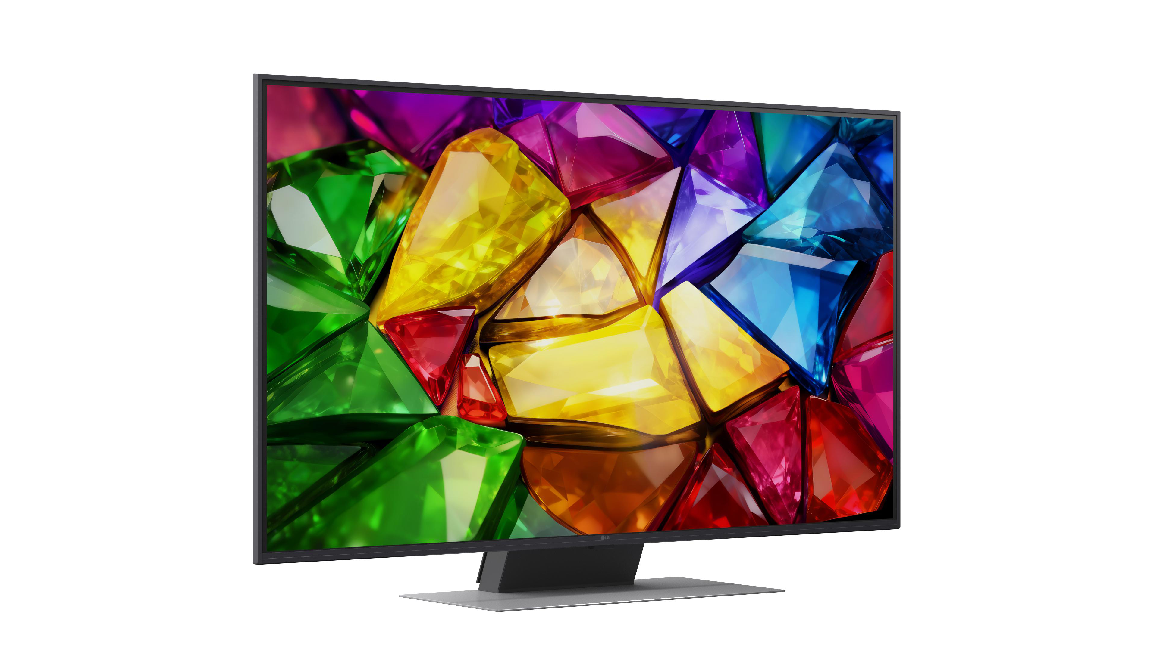 Ein Fernseher zeigt ein Muster aus bunten, facettierten Edelsteinen in Rot, Grün, Gelb und Blau.