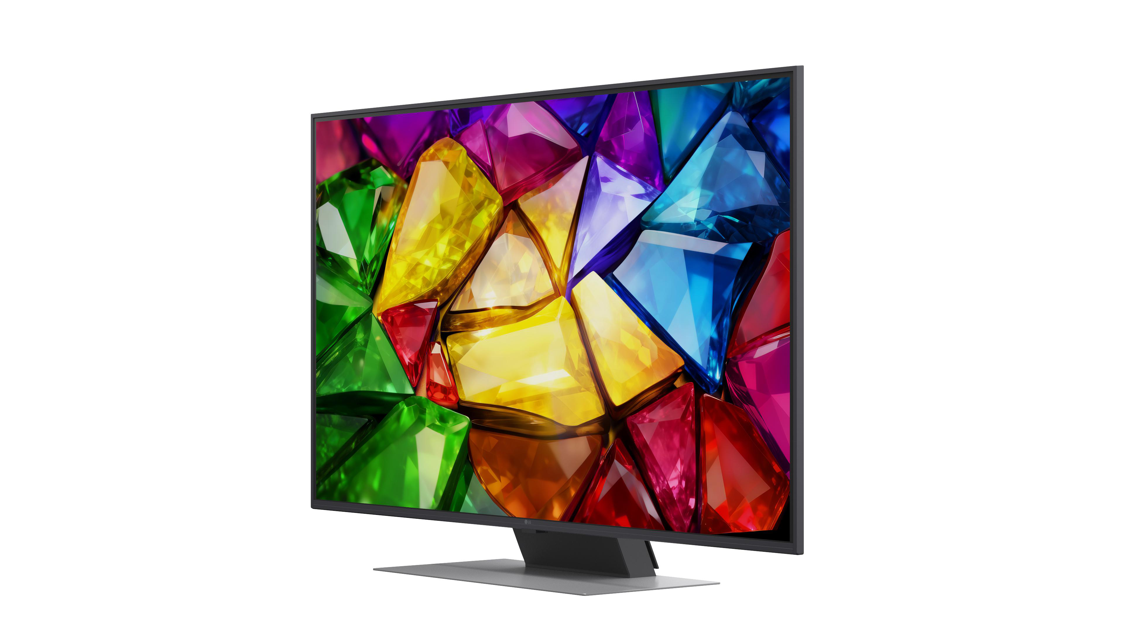 Ein moderner Fernseher mit einem bunten Edelsteinmuster auf dem Bildschirm steht auf einem Sockel.