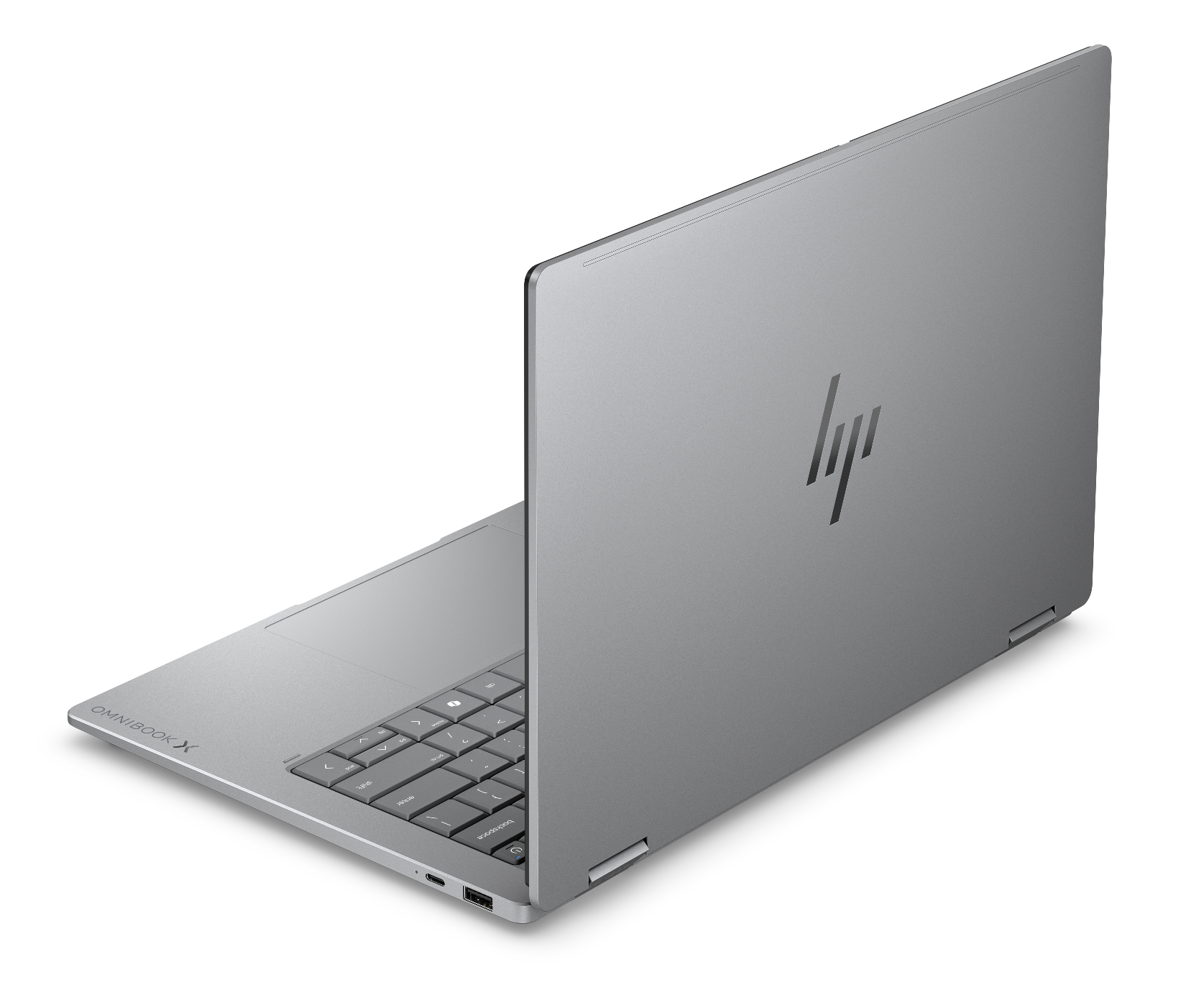 Gümüş rengi HP Omnibook X dizüstü bilgisayar, klavyesi ve bağlantı noktaları görülebilecek şekilde kısmen açıktır.