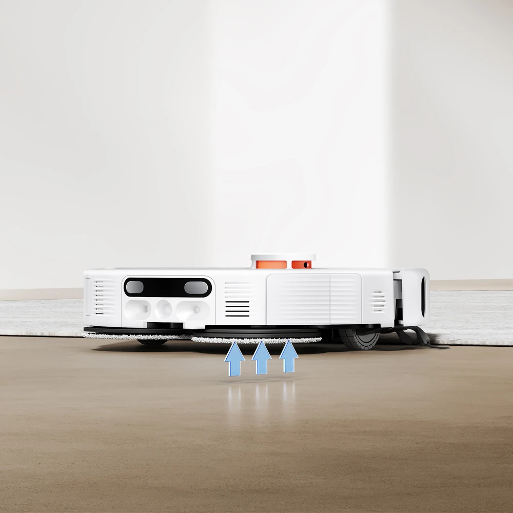 Un robot aspirateur blanc sur un plancher en bois avec des flèches bleues pointant vers le haut.
