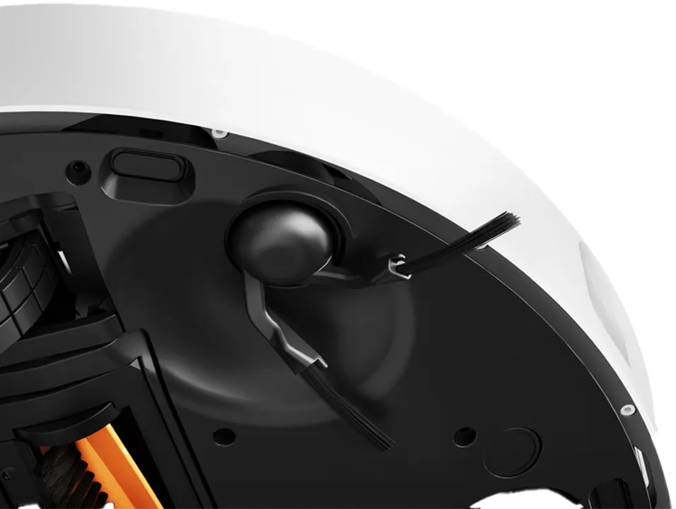 Nahaufnahme des Bodens eines weißen Roboters mit schwarzen Bürsten und einem Rad.