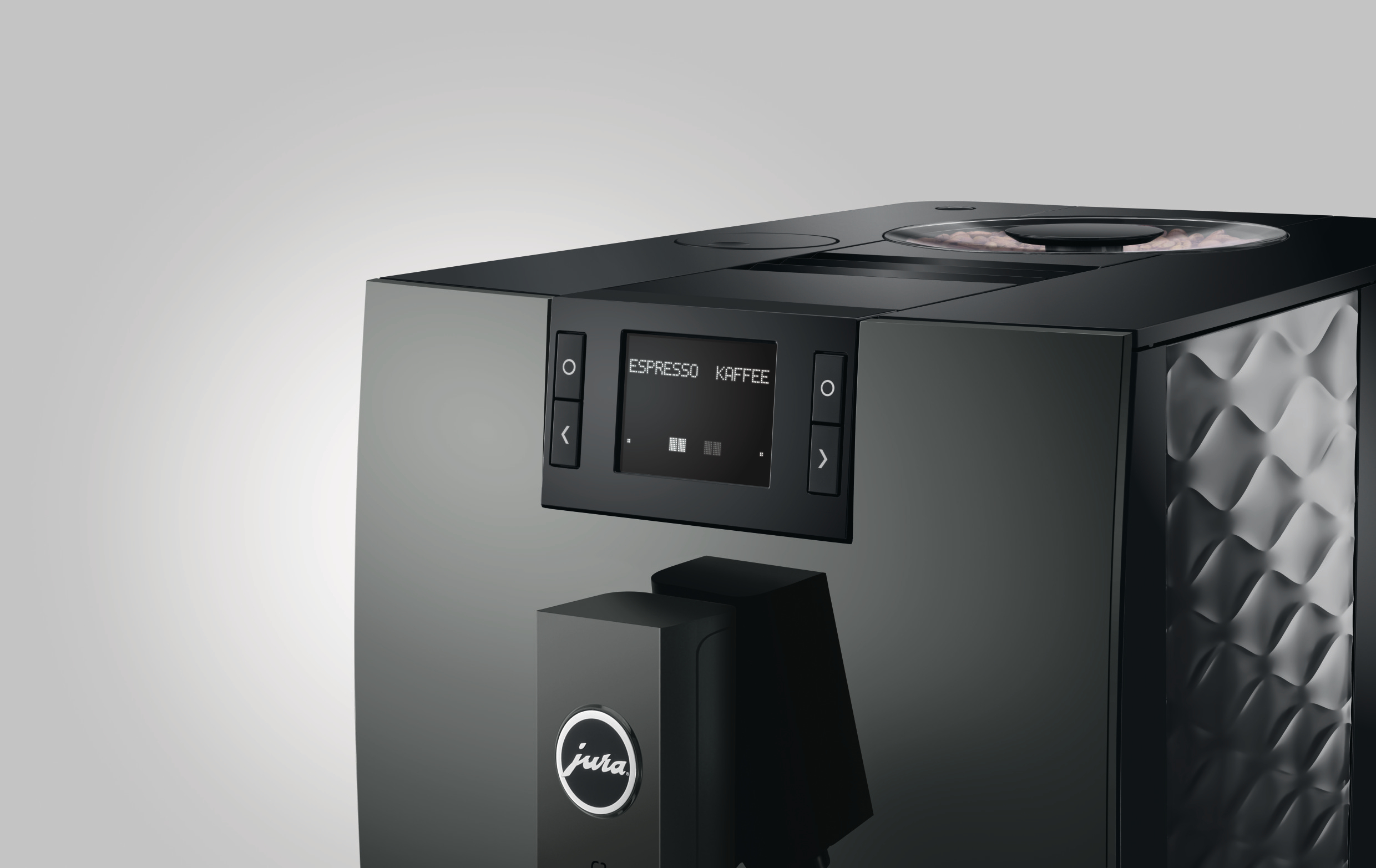Eine schwarze Jura Kaffeemaschine mit einem Bildschirm, der "Espresso Kaffee" anzeigt.