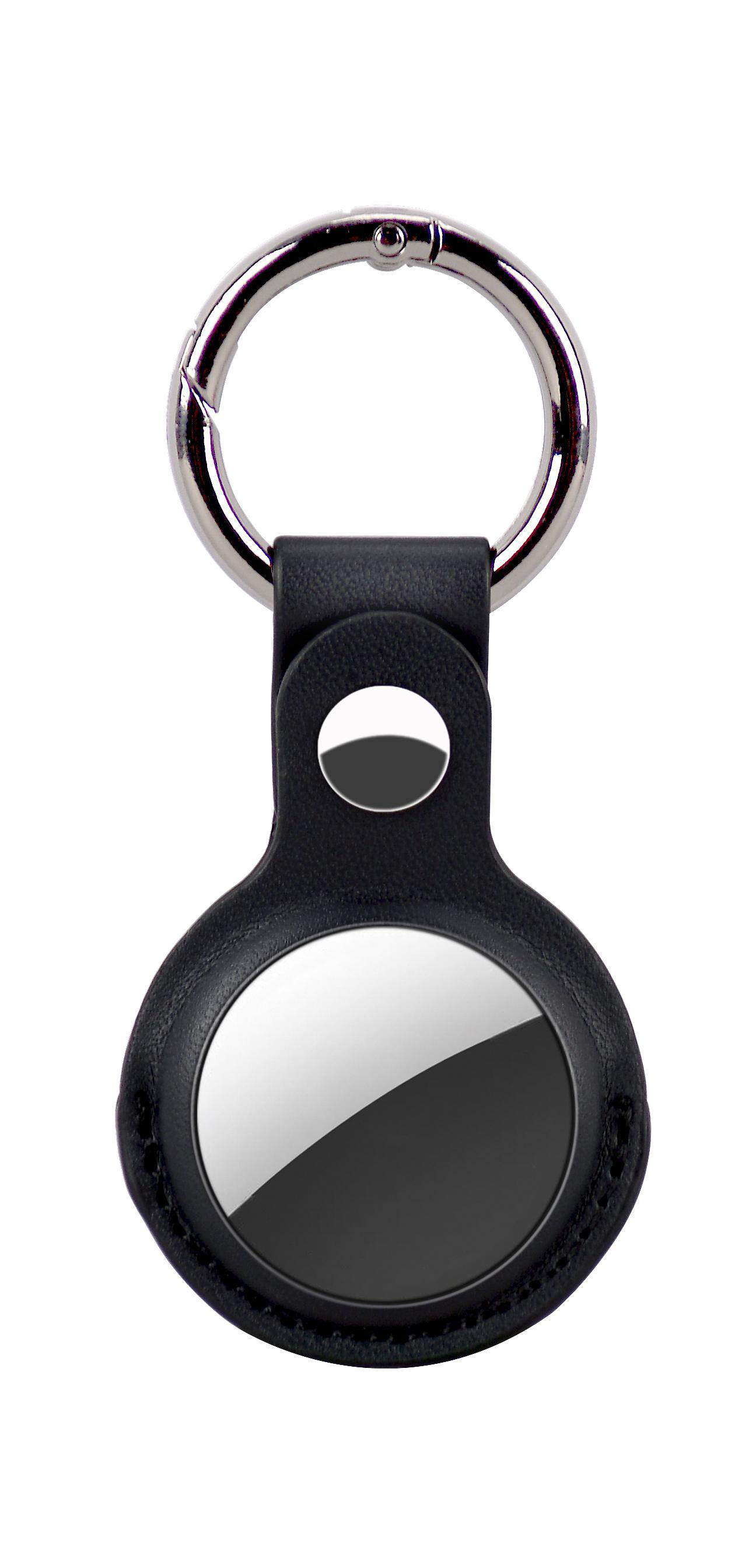 Ein schwarzer Schlüsselschutz mit silbernem Ring und einem reflektierenden kreisförmigen Einsatz.