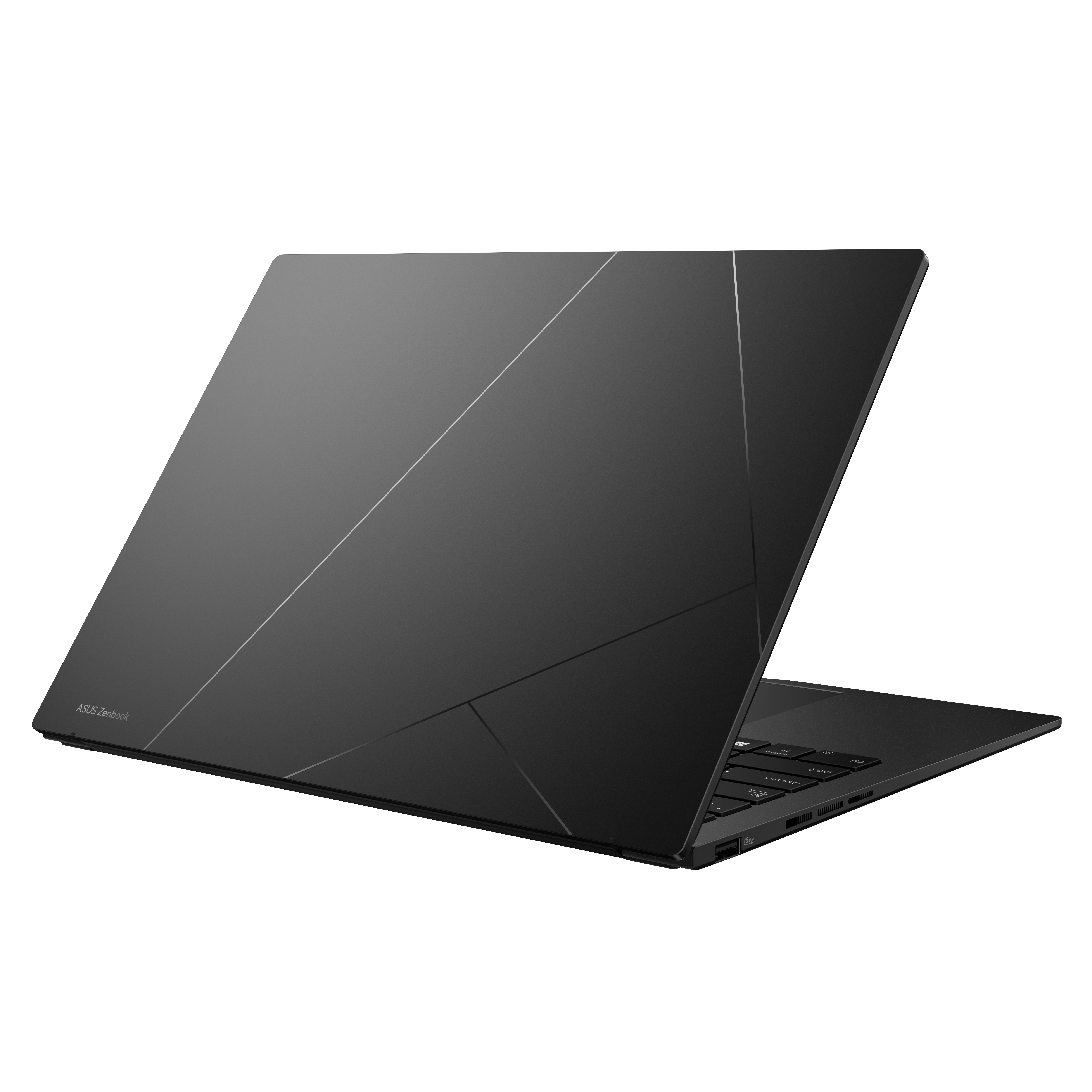 Een gesloten, donkere laptop met een geometrisch ontwerp op de deksel.