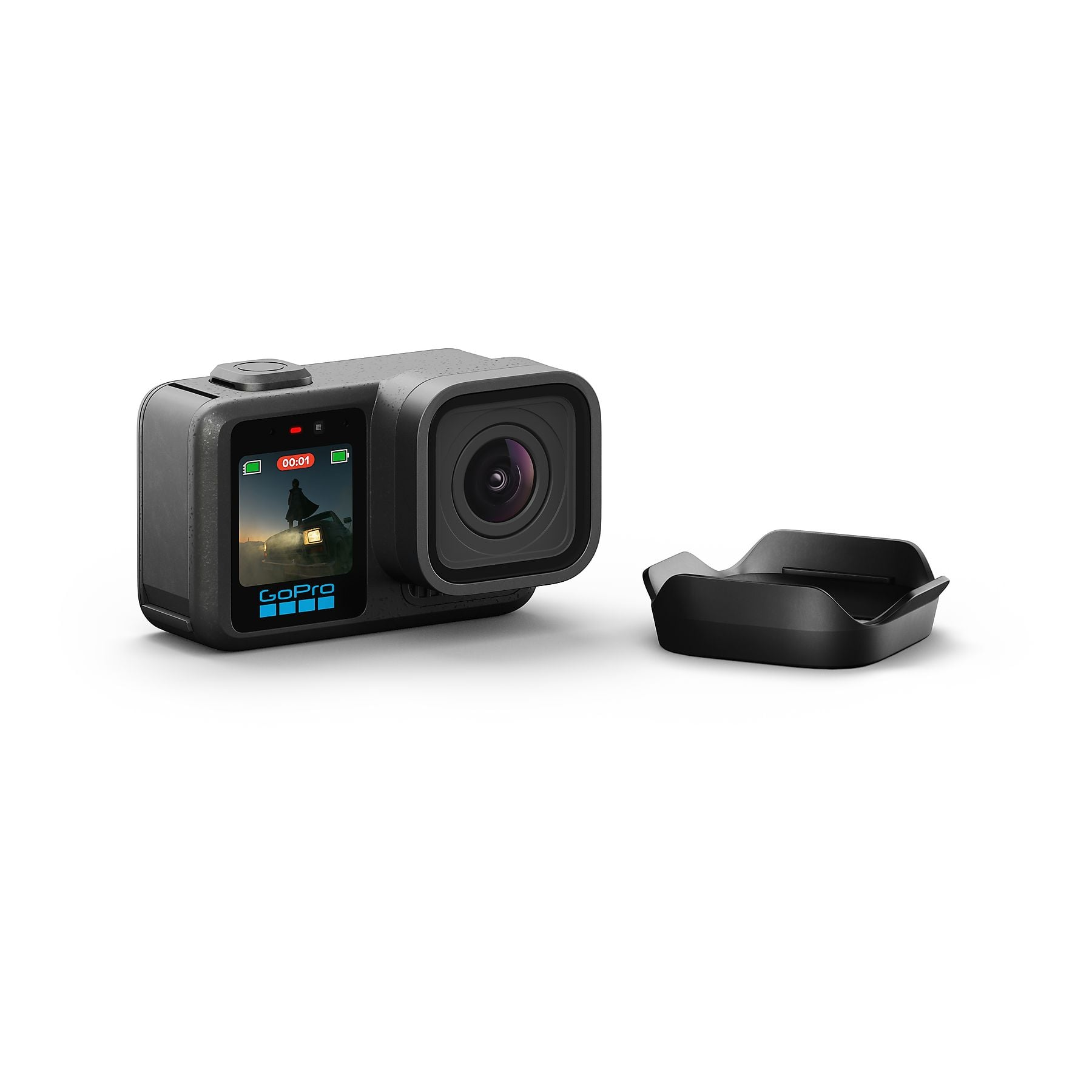 Una cámara GoPro negra con una pequeña carcasa negra al lado.