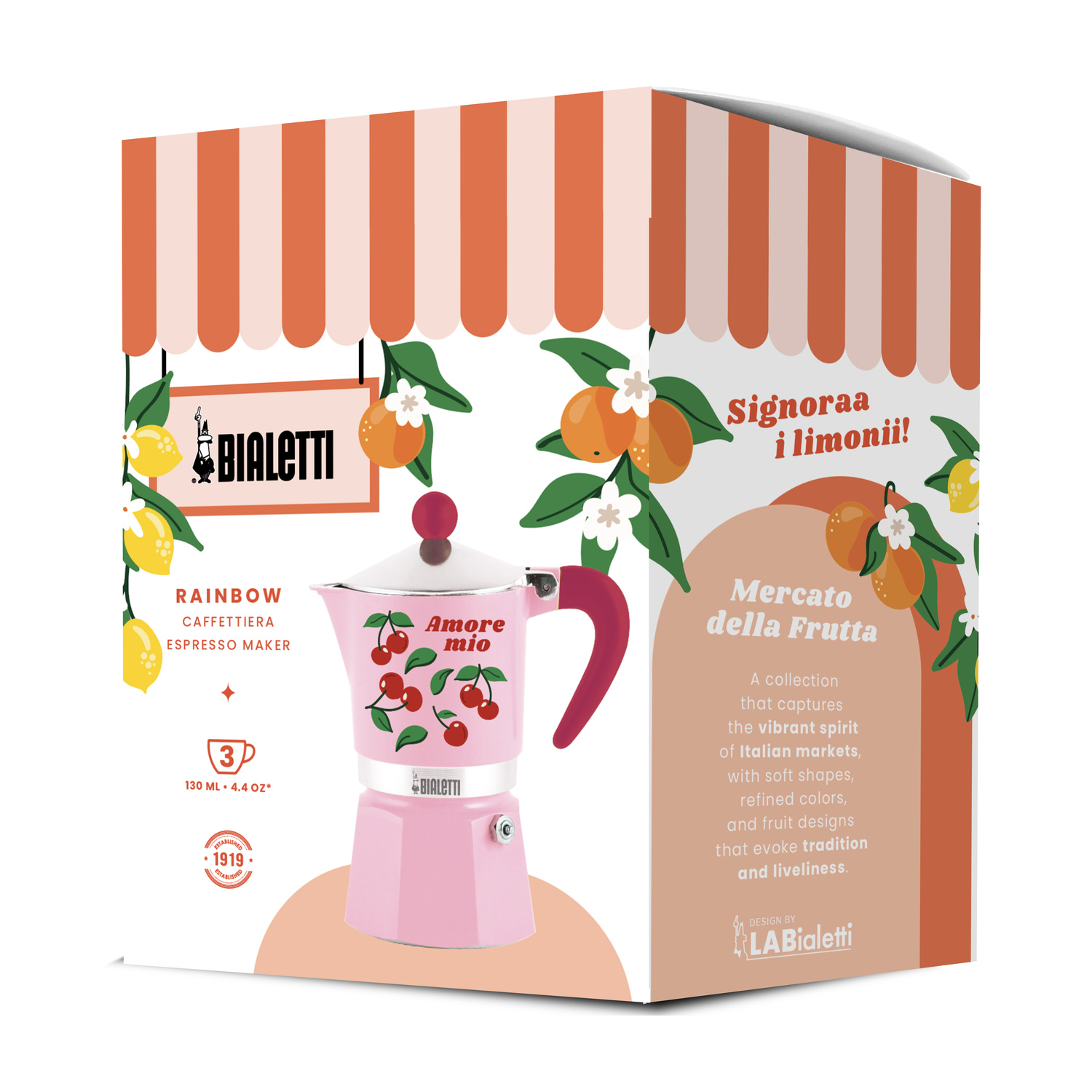 Una moka Bialetti rosa con ciliegie e limoni sulla confezione.