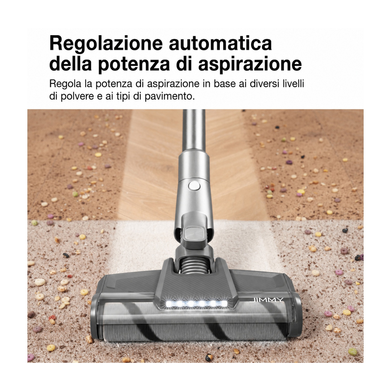 Una testina aspirapolvere grigia con luci pulisce il tappeto dai detriti.