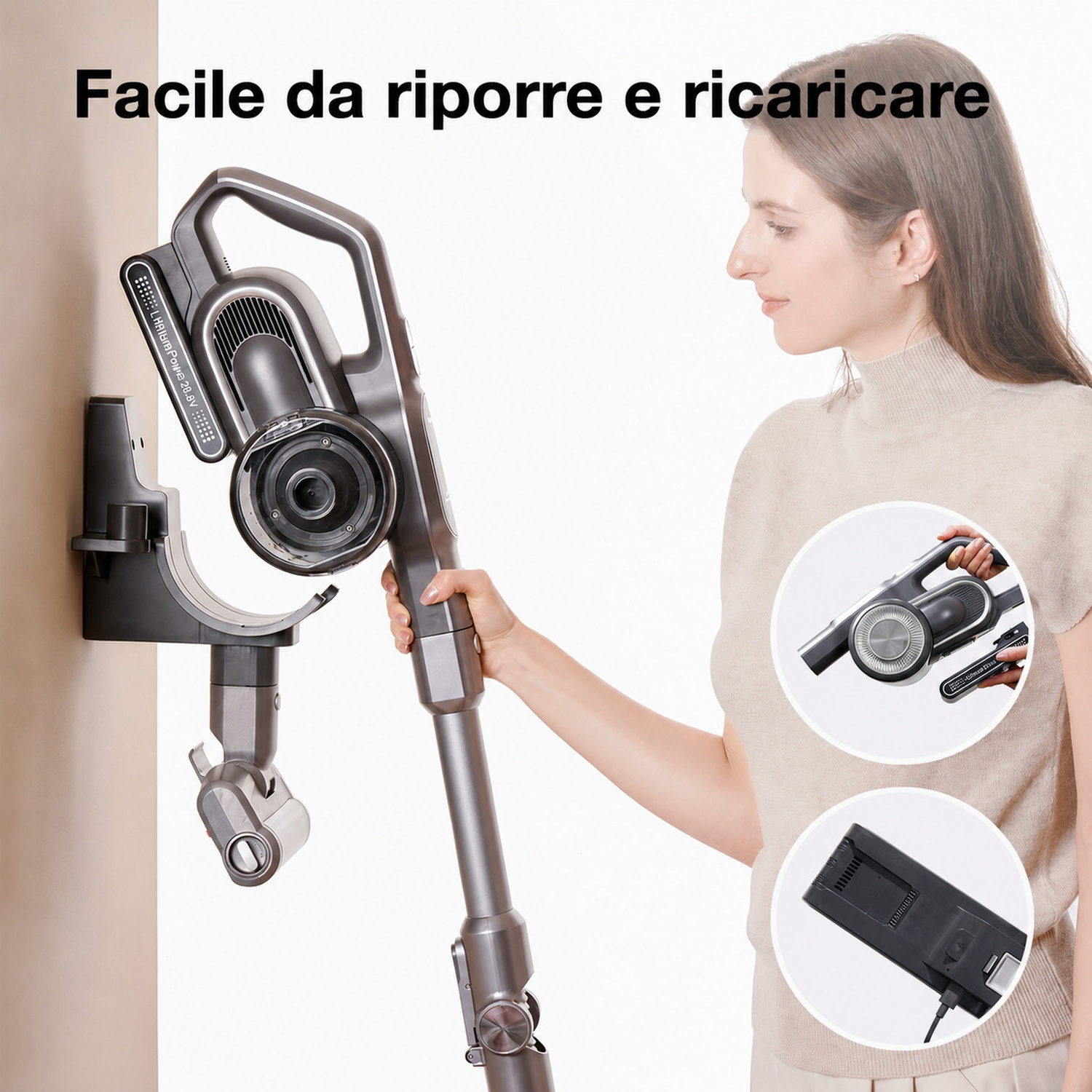 Una donna tiene un aspirapolvere senza fili grigio con supporto a muro.