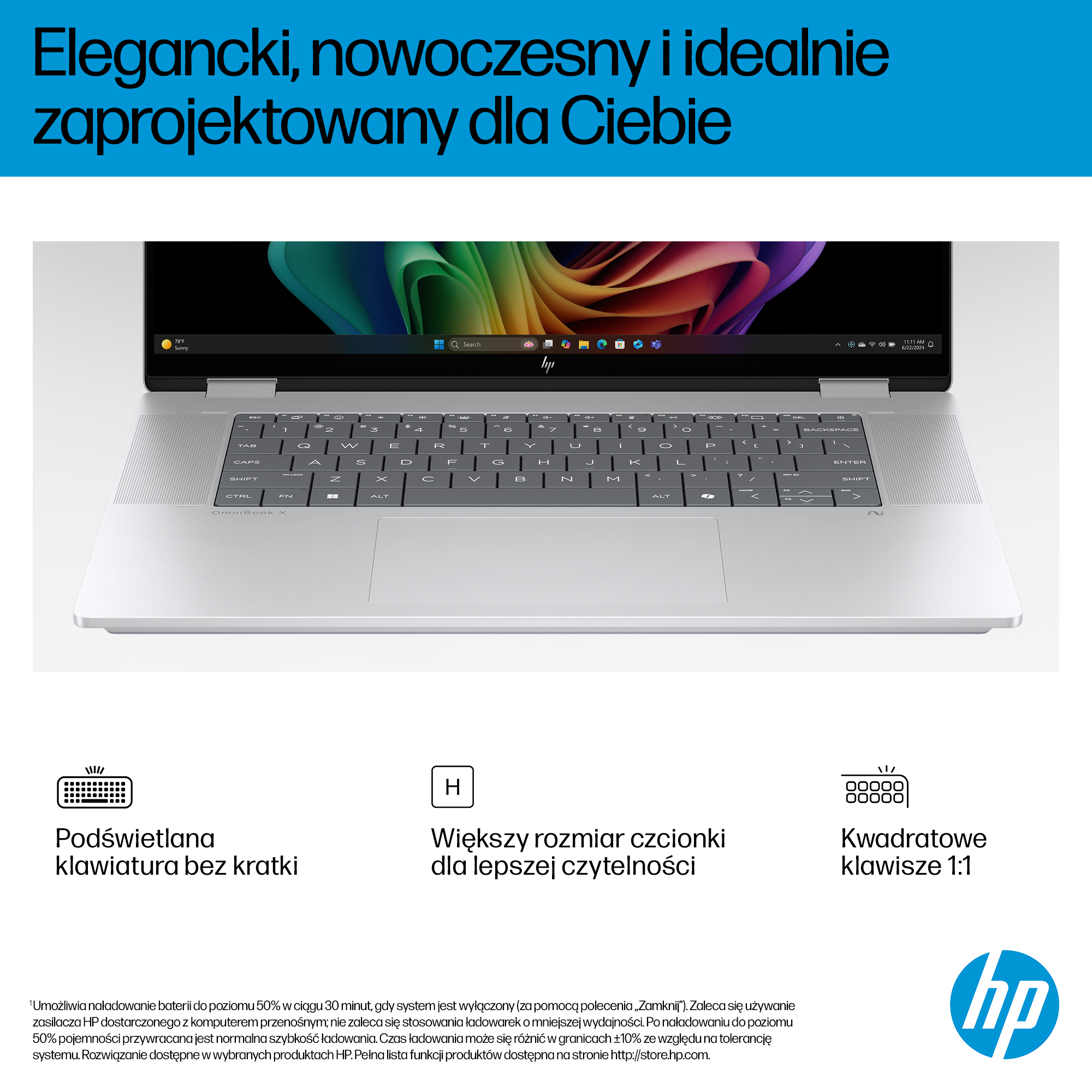 Srebrny laptop z podświetlaną klawiaturą i kolorową tapetą na ekranie.