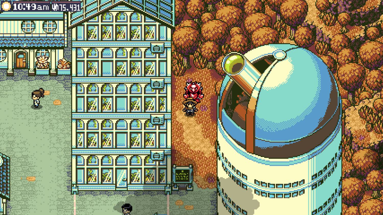 Una persona está junto a un observatorio, un edificio de varios pisos y árboles.