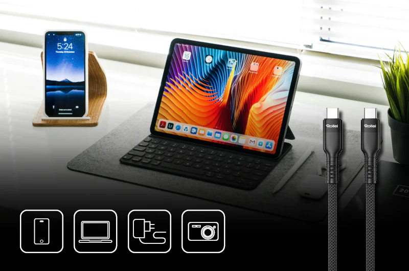 Ein Telefon und Tablet auf einem Schreibtisch mit Ladekabeln und Symbolen für Telefon, Laptop, Ladegerät, Kamera.