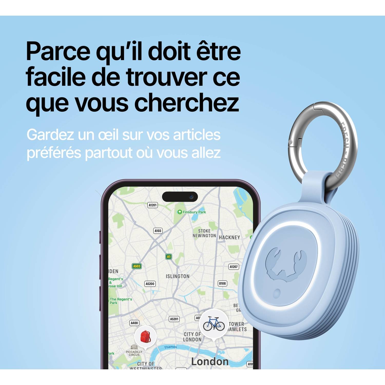 Un traqueur bleu avec porte-clés à côté d'un smartphone affichant une carte de Londres.