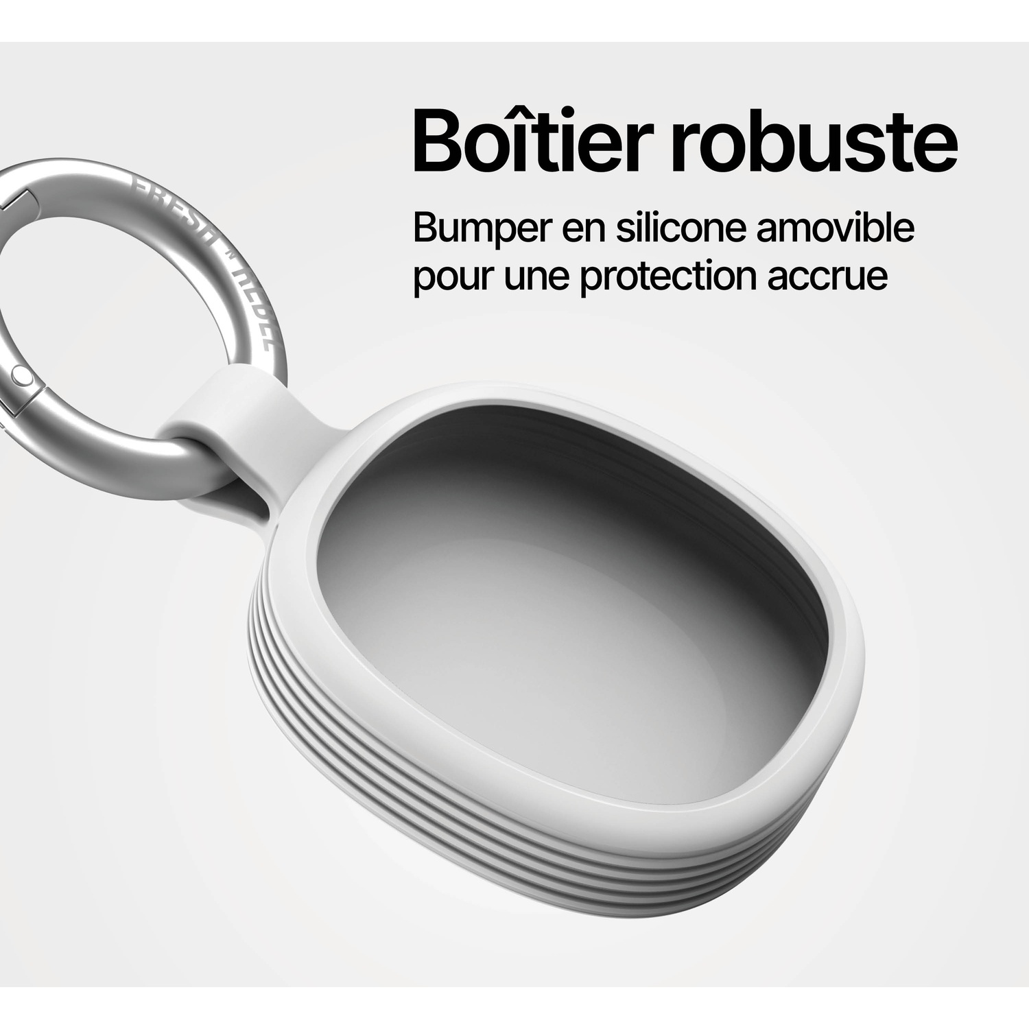 Un étui en silicone blanc avec porte-clés argenté, tournant autour d'un intérieur gris.