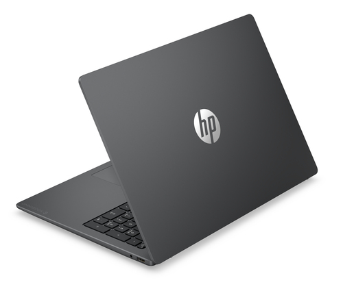 Un portátil HP cerrado y oscuro con logo plateado en la tapa.
