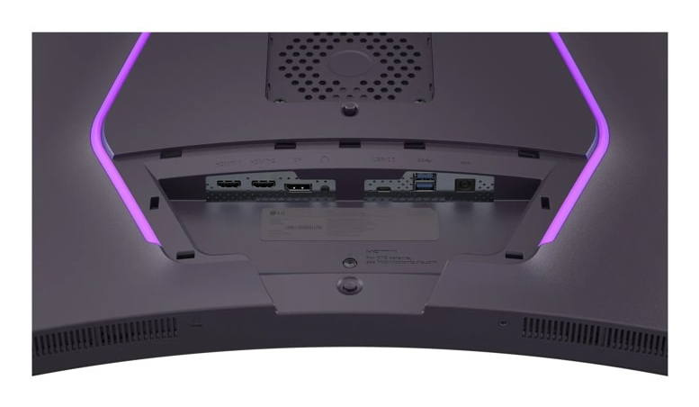 Parte trasera de un monitor mostrando puertos e iluminación púrpura.