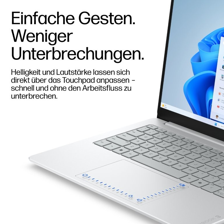 Ein silberner Laptop mit deutschen Texten und einem Windows-Bildschirm.