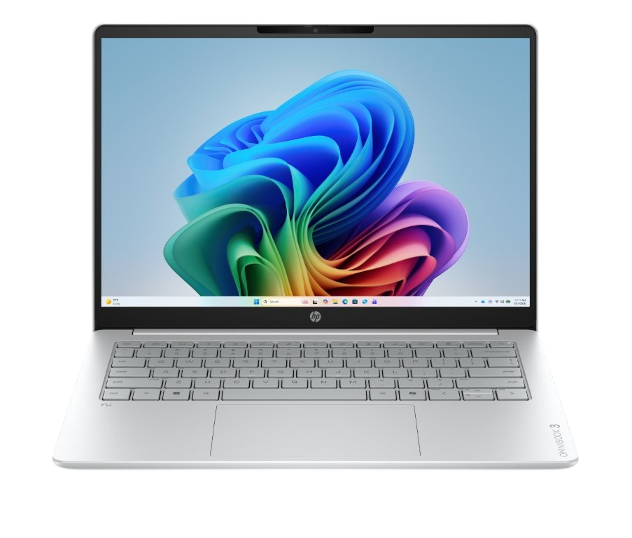 Ein silberner HP Laptop ist geöffnet und zeigt einen bunten abstrakten Hintergrund auf dem Bildschirm und eine Tastatur.