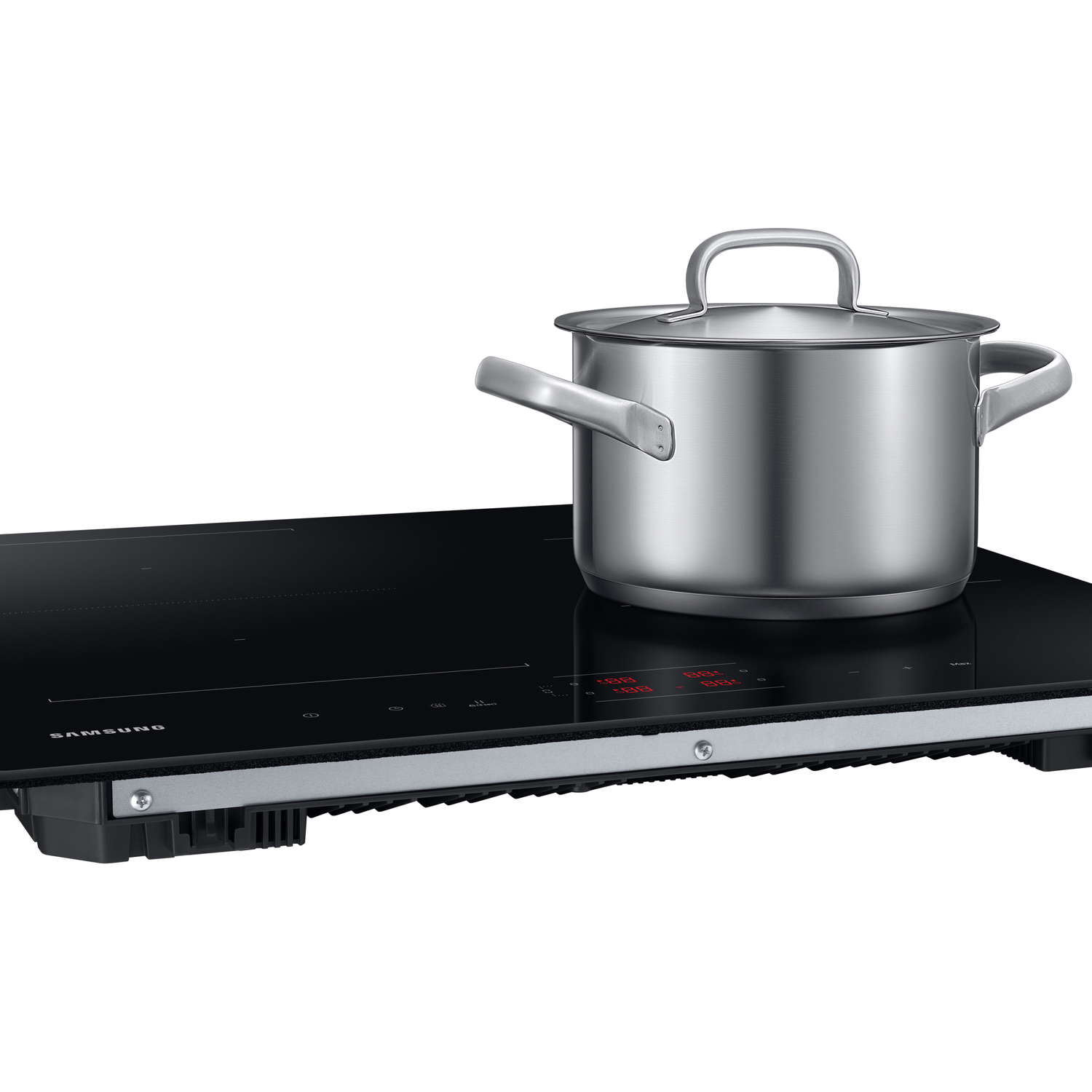 A silver pot rests on a black induction cooktop with red digital displays.