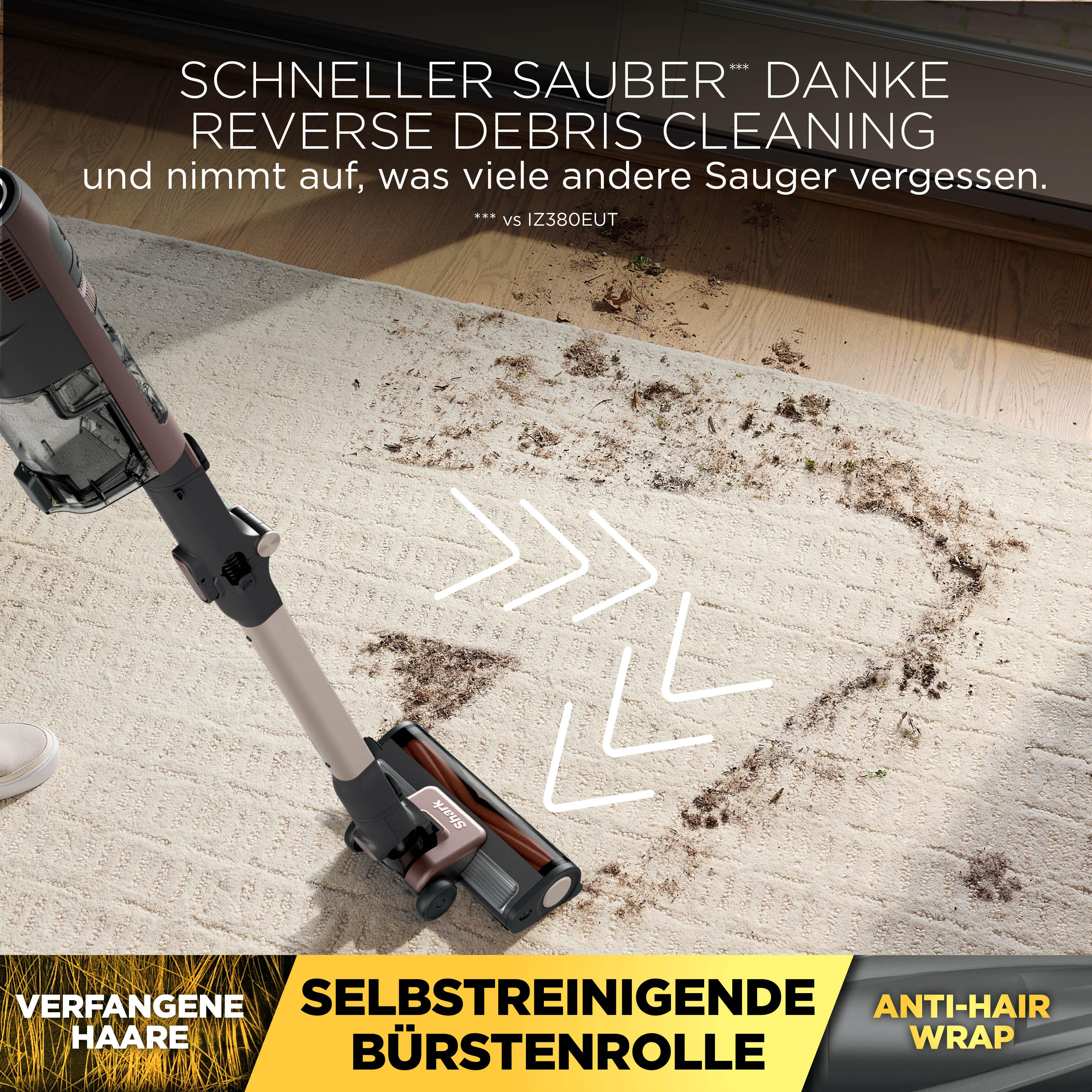 Ein Staubsauger reinigt einen Teppich mit Schmutz und Haaren.