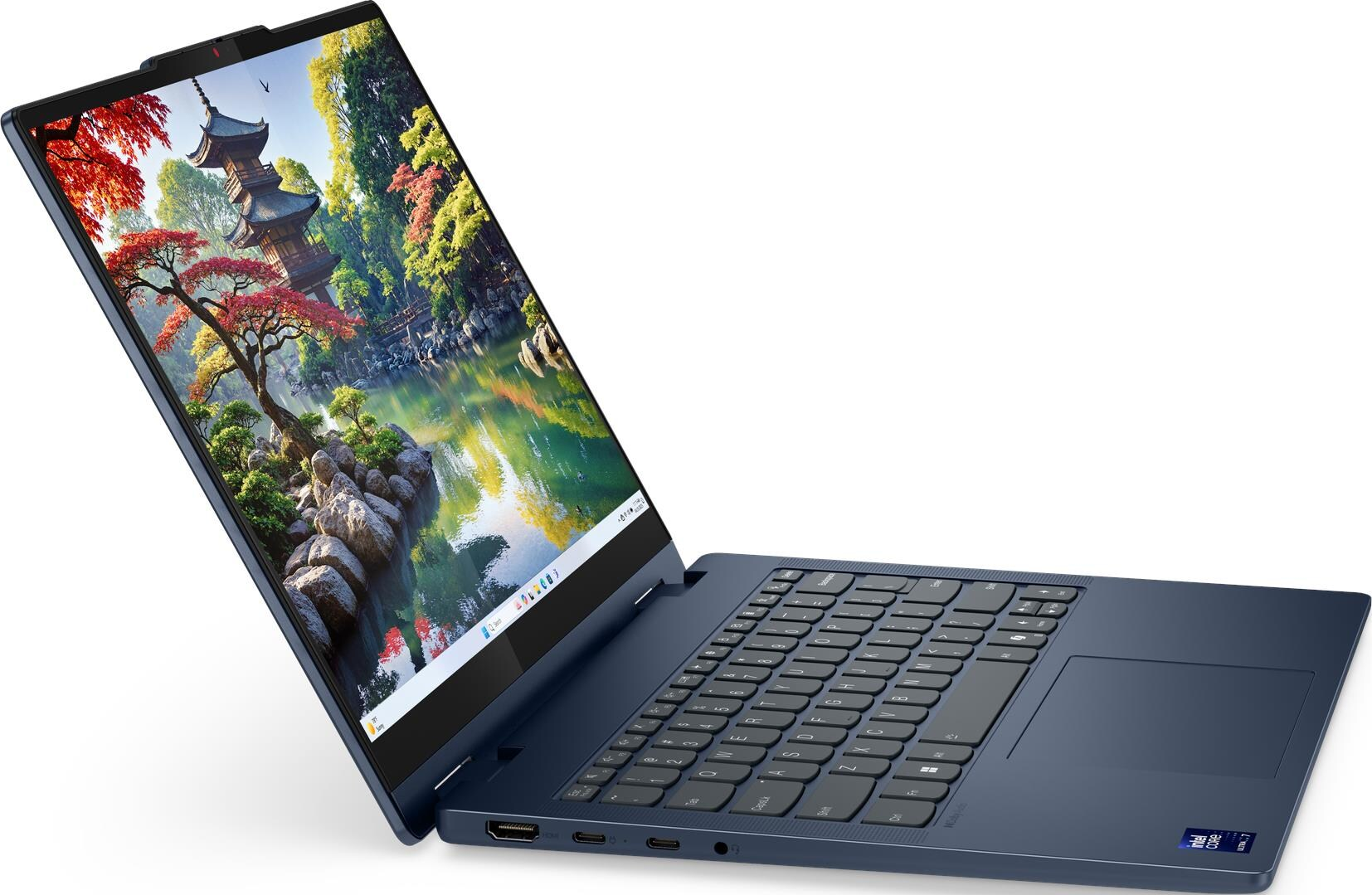 Ein geöffnetes blaues Laptop zeigt ein Bild eines japanischen Gartens mit Pagode.