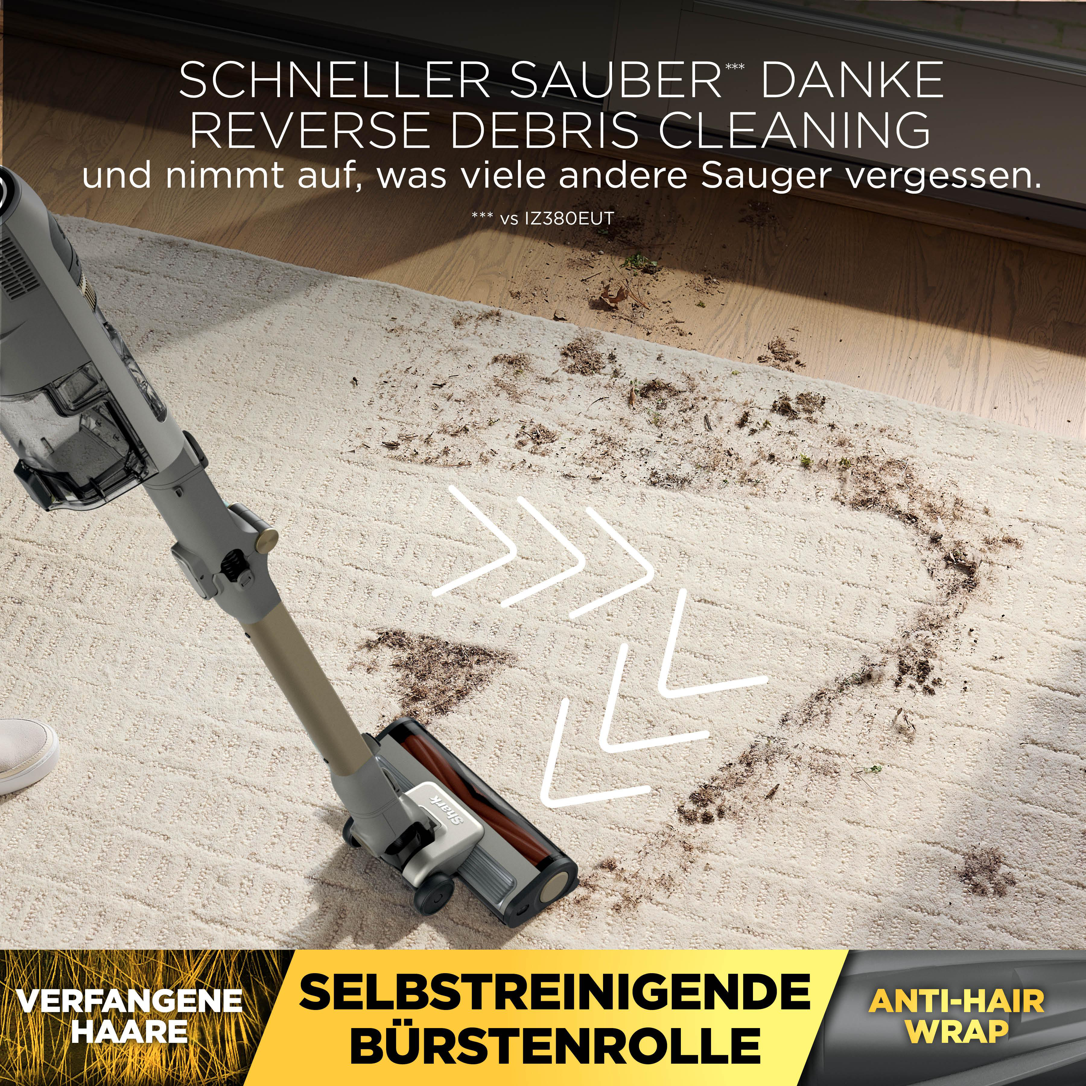 Ein Staubsauger reinigt einen hellen Teppich von Schmutz und Haaren.