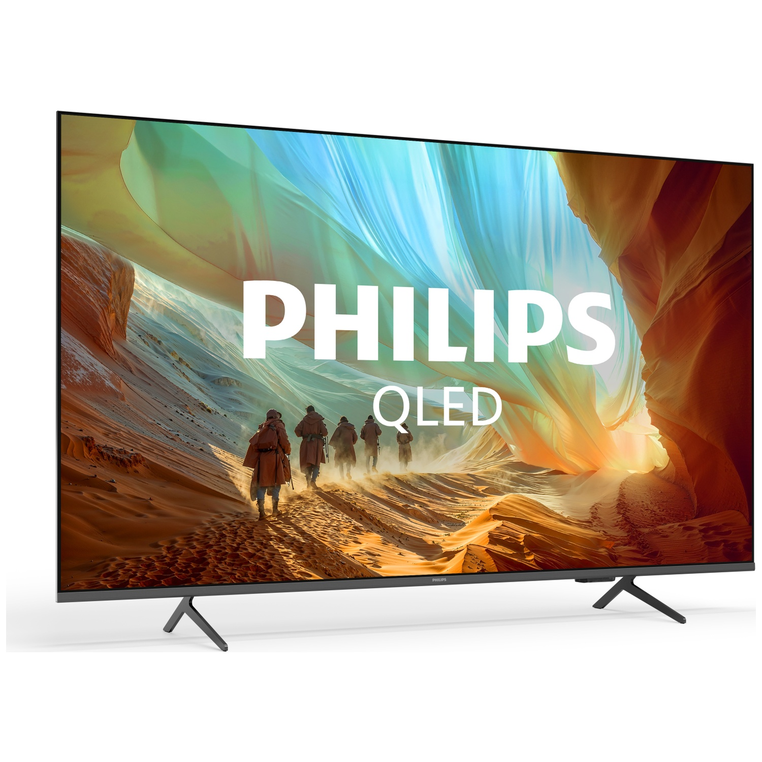 A Philips QLED TV displaying an image of hikers in a desert landscape.