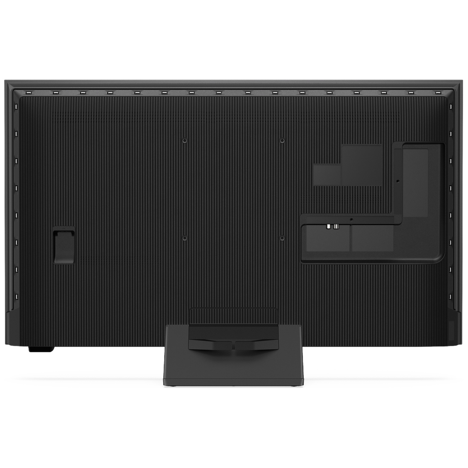 Back of a black television with vertical ribs and ports. Stand attached.