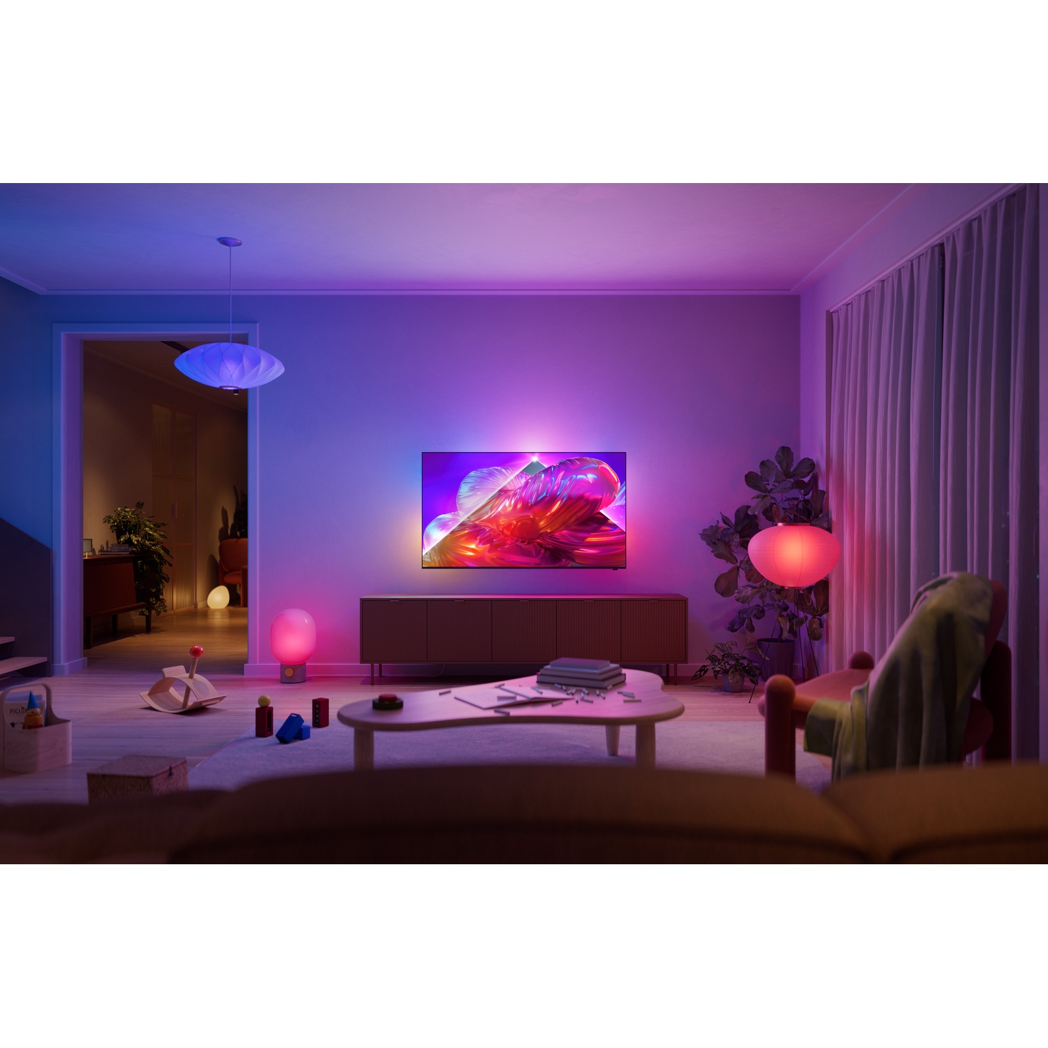 Modern living room with TV, ambient lighting, and toys.