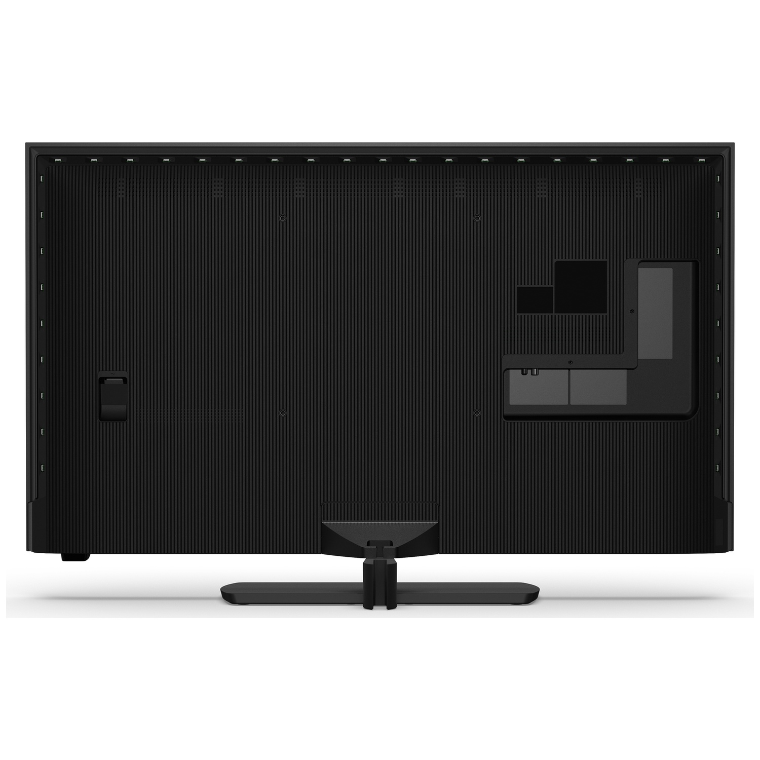 Back of a black flat-screen TV with a ribbed texture and stand.