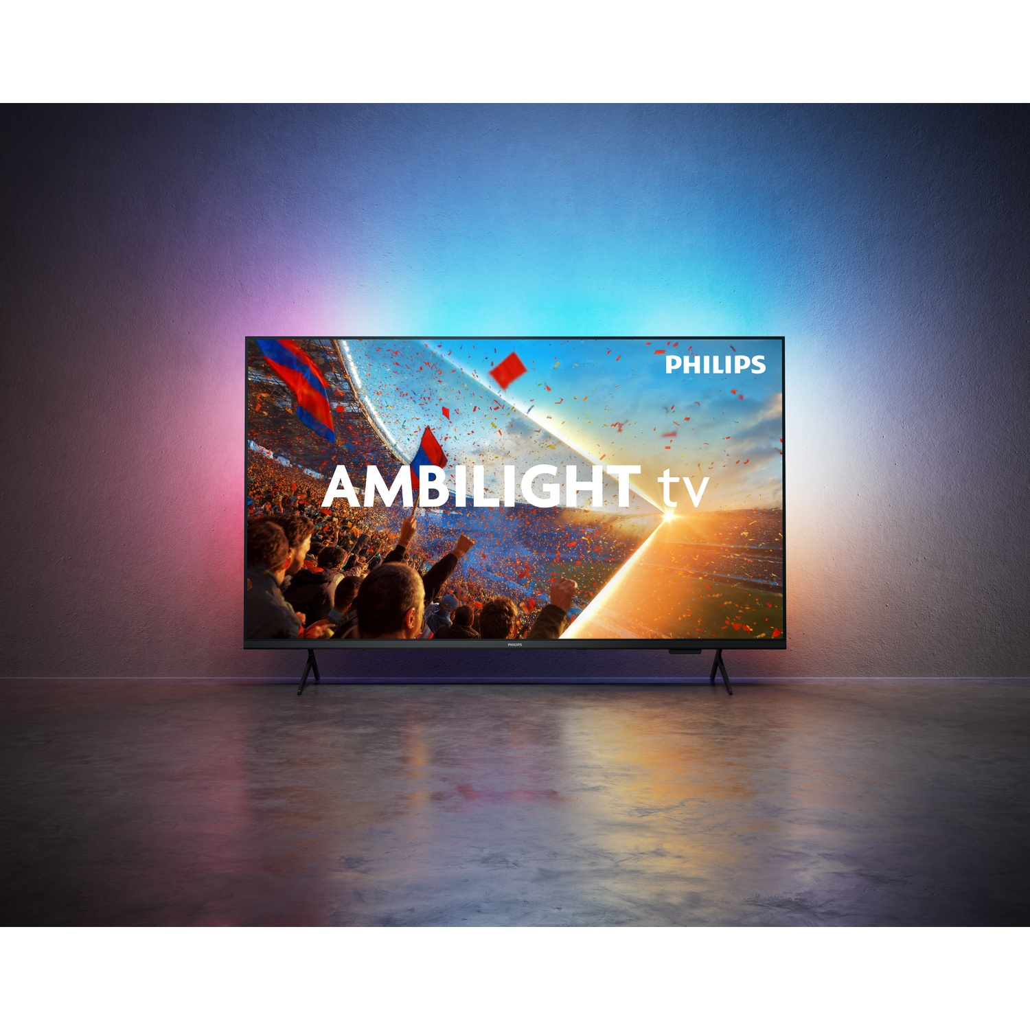 A Philips Ambilight TV displays a cheering football crowd with flags.