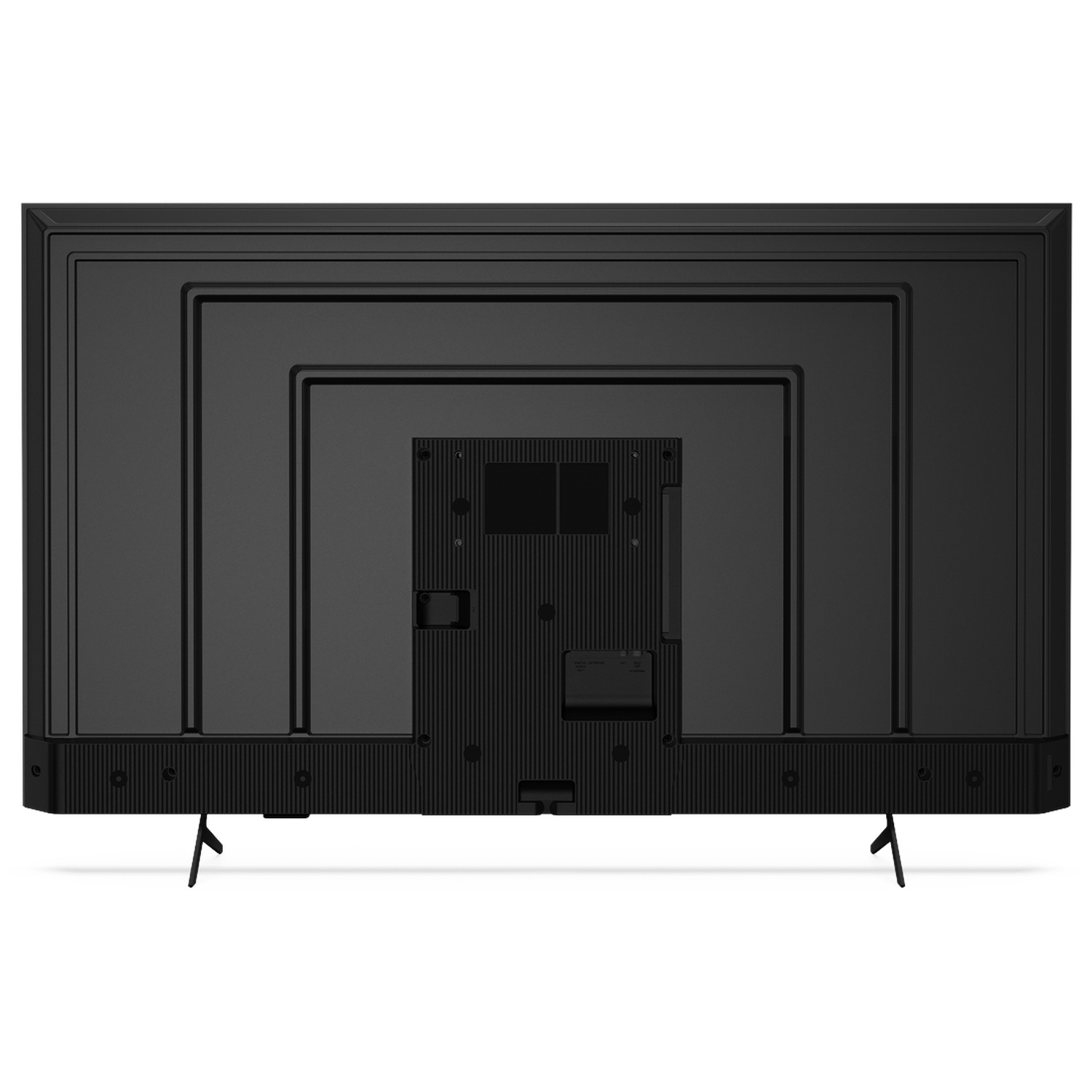 Back of a black television with stand legs, ports, and ventilation slots.
