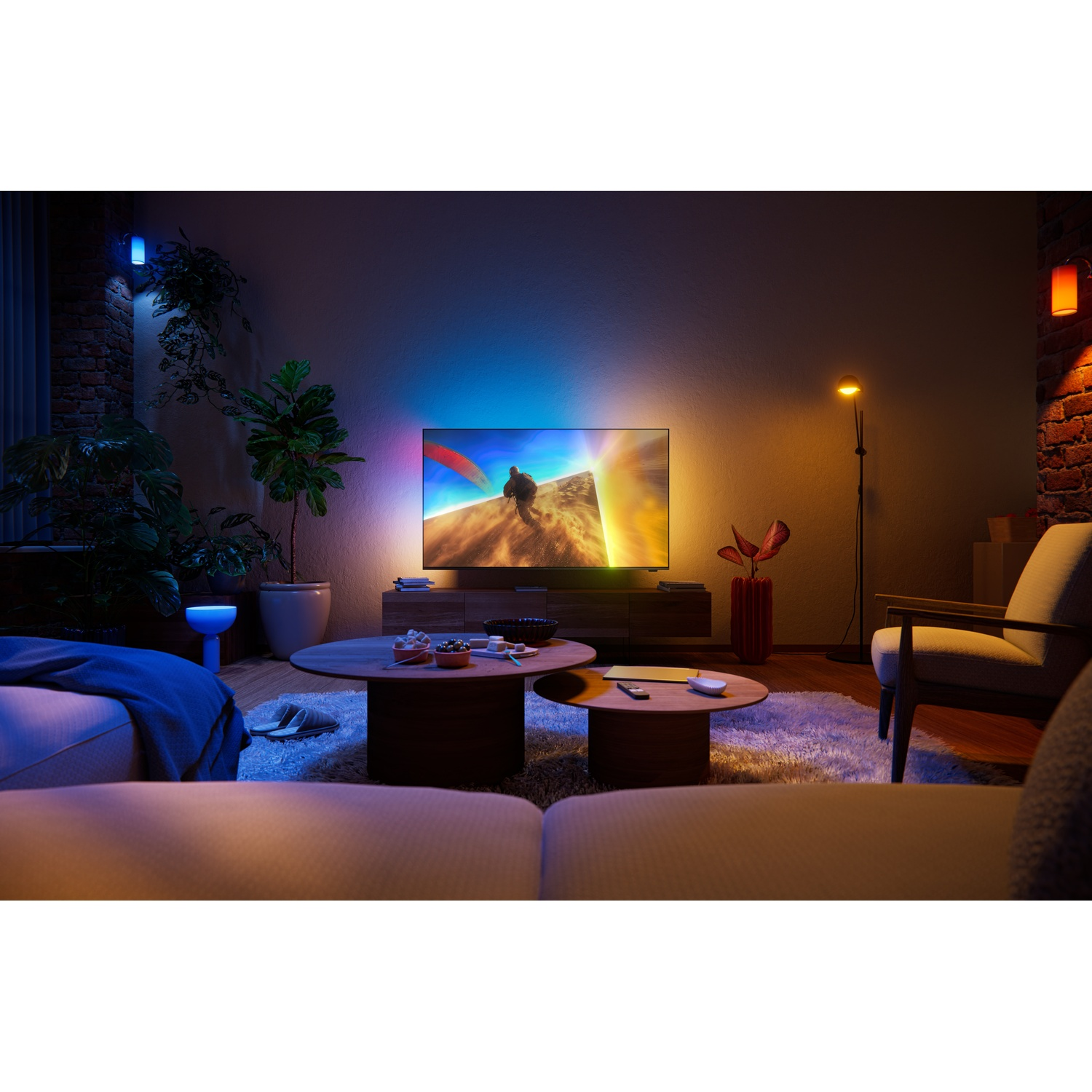 A living room with a TV showing a paraglider. Colorful lights illuminate the space.
