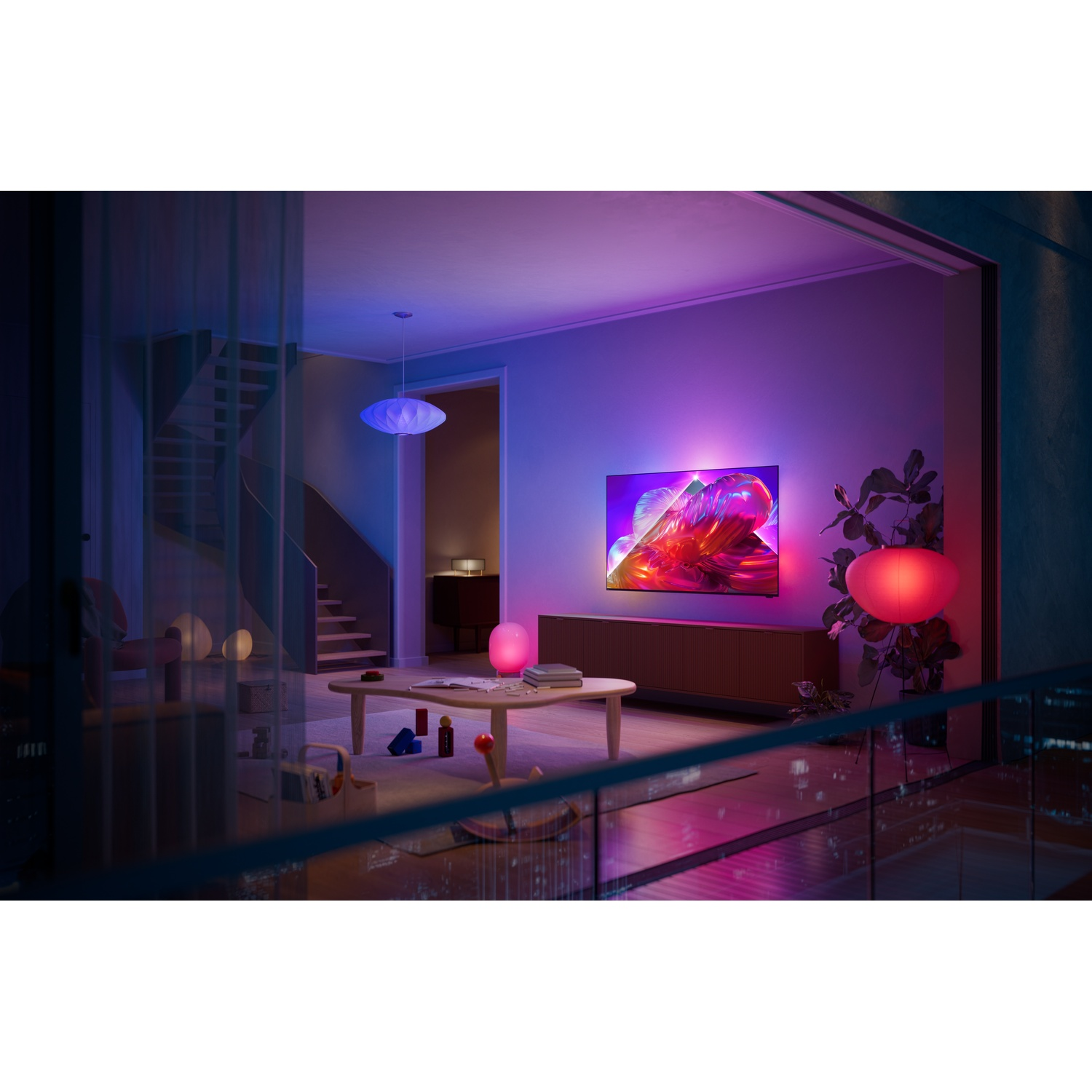 A living room illuminated by blue and red lights, featuring a TV and furniture.